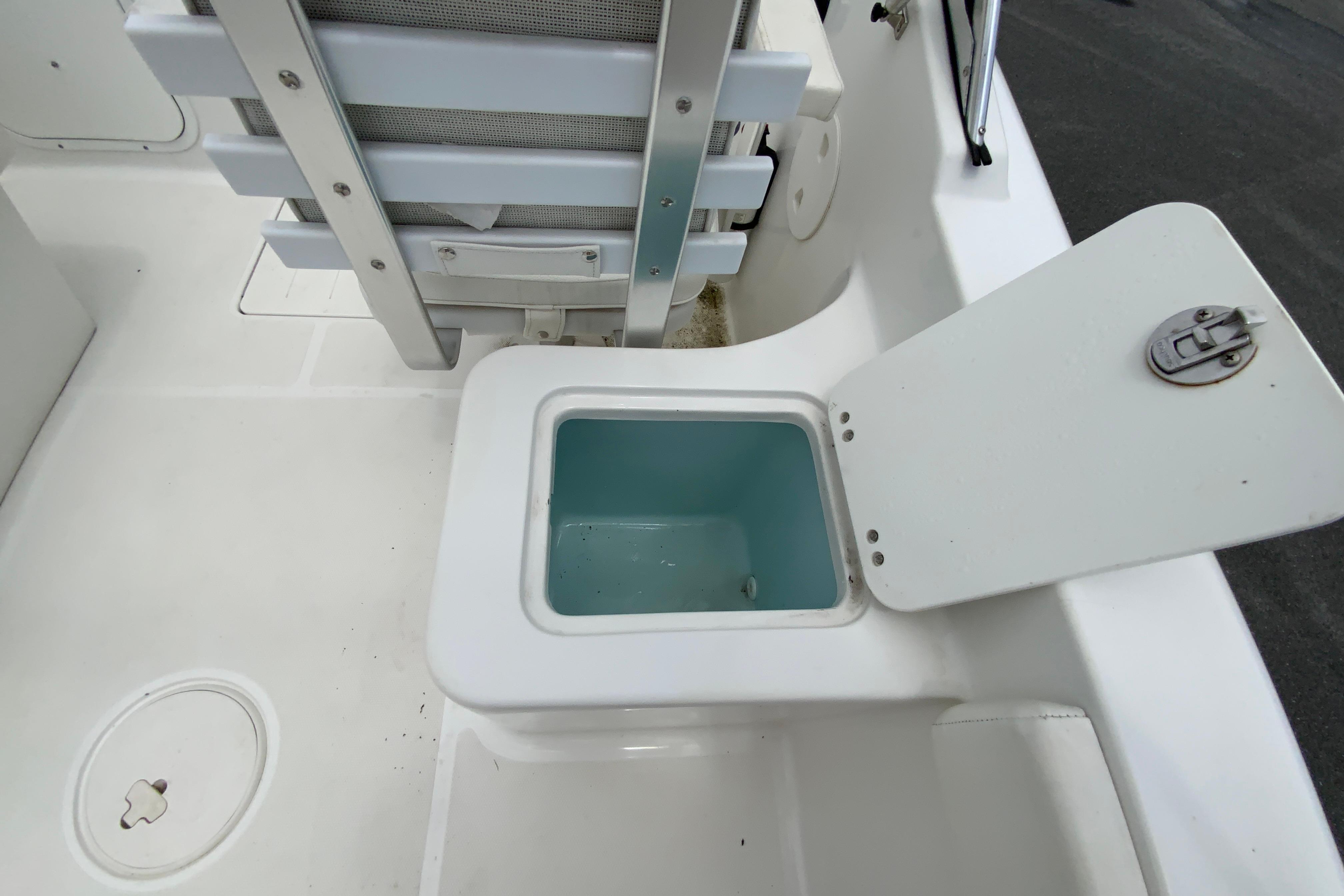 2014 Sea Hunt Escape 211 LE boat interior with open storage compartment.