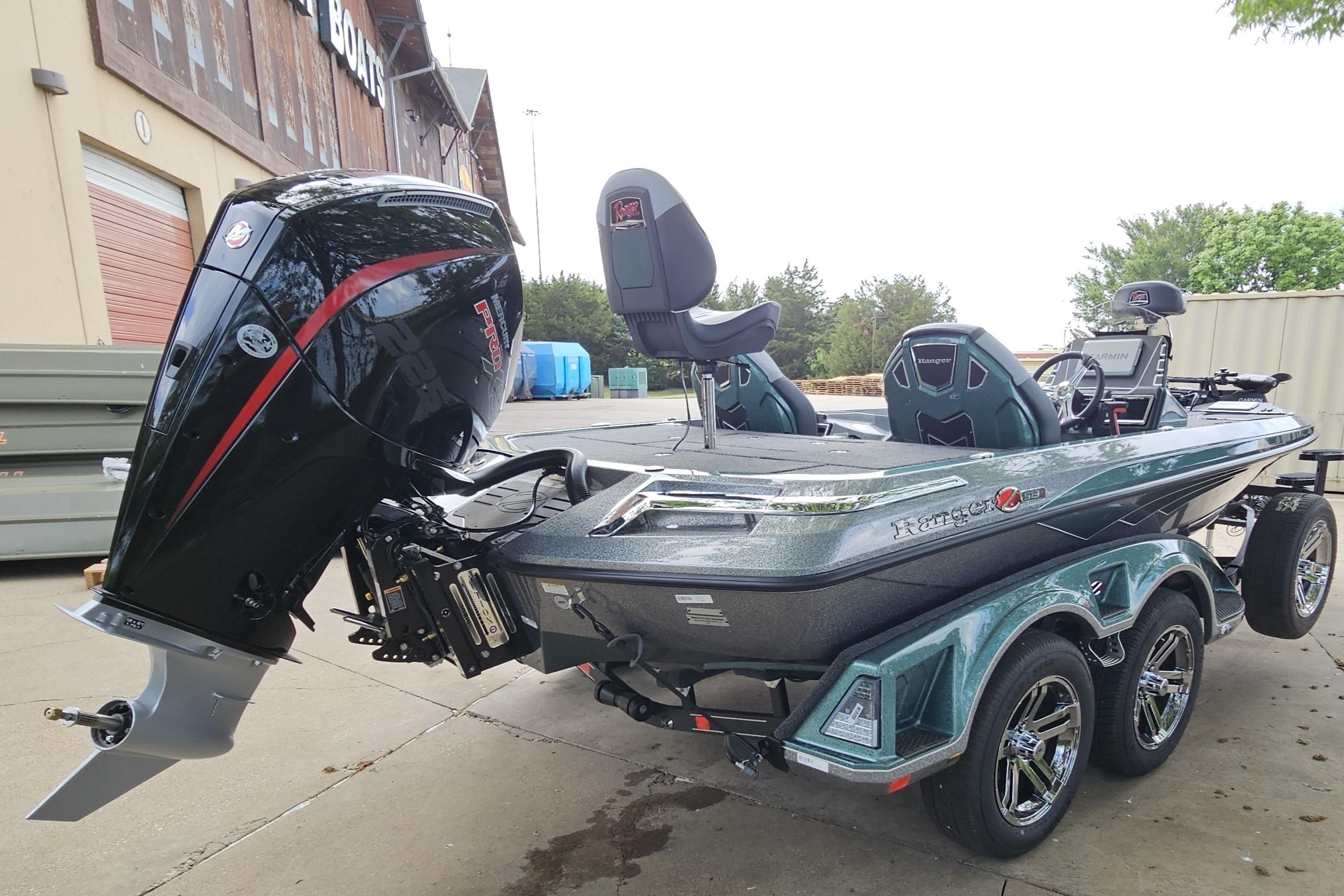 2026 Ranger Z519R Cup-Equipped boat with powerful outboard motor, parked outdoors.