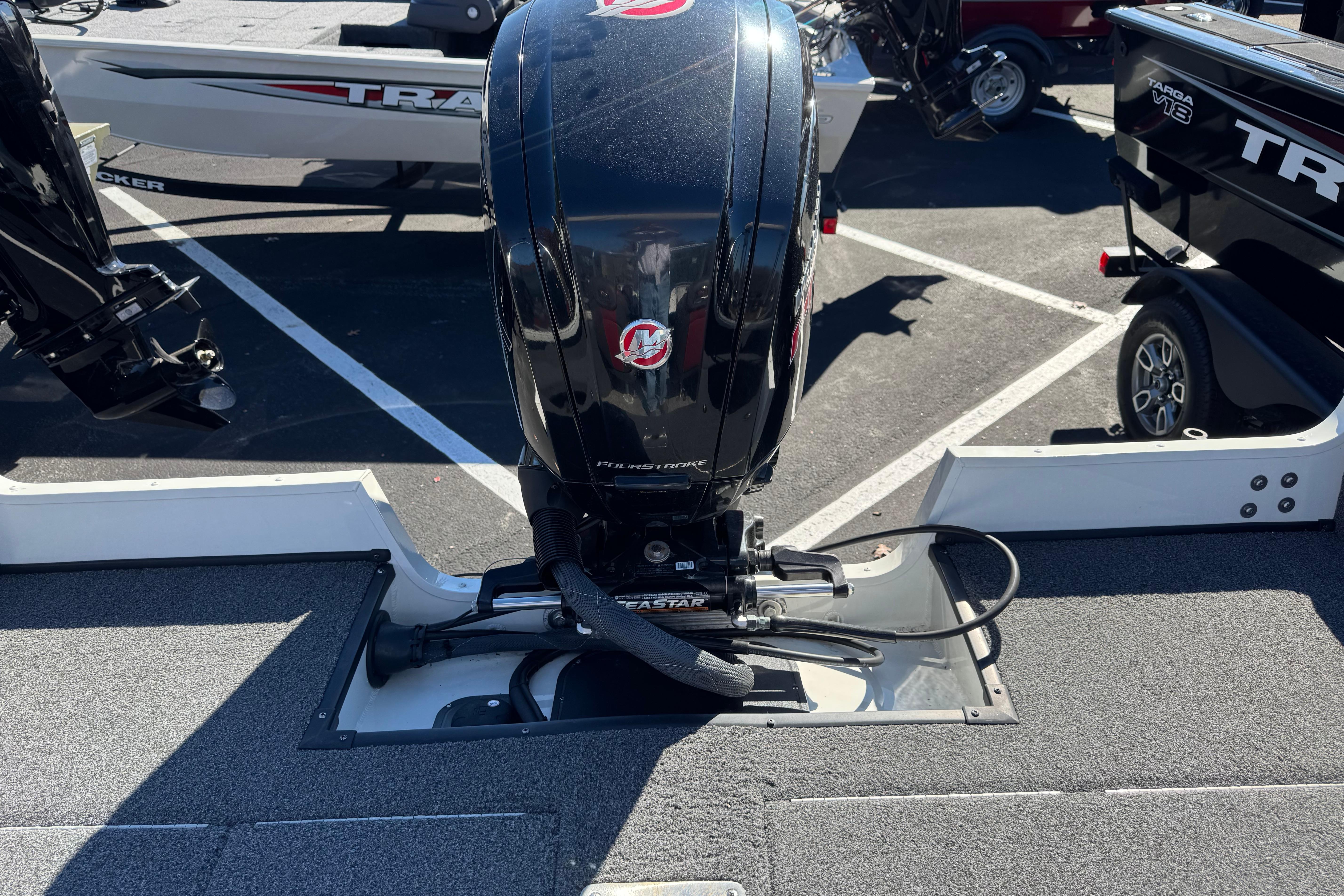 2020 Ranger VS1682 WT boat with powerful outboard motor in parking lot.