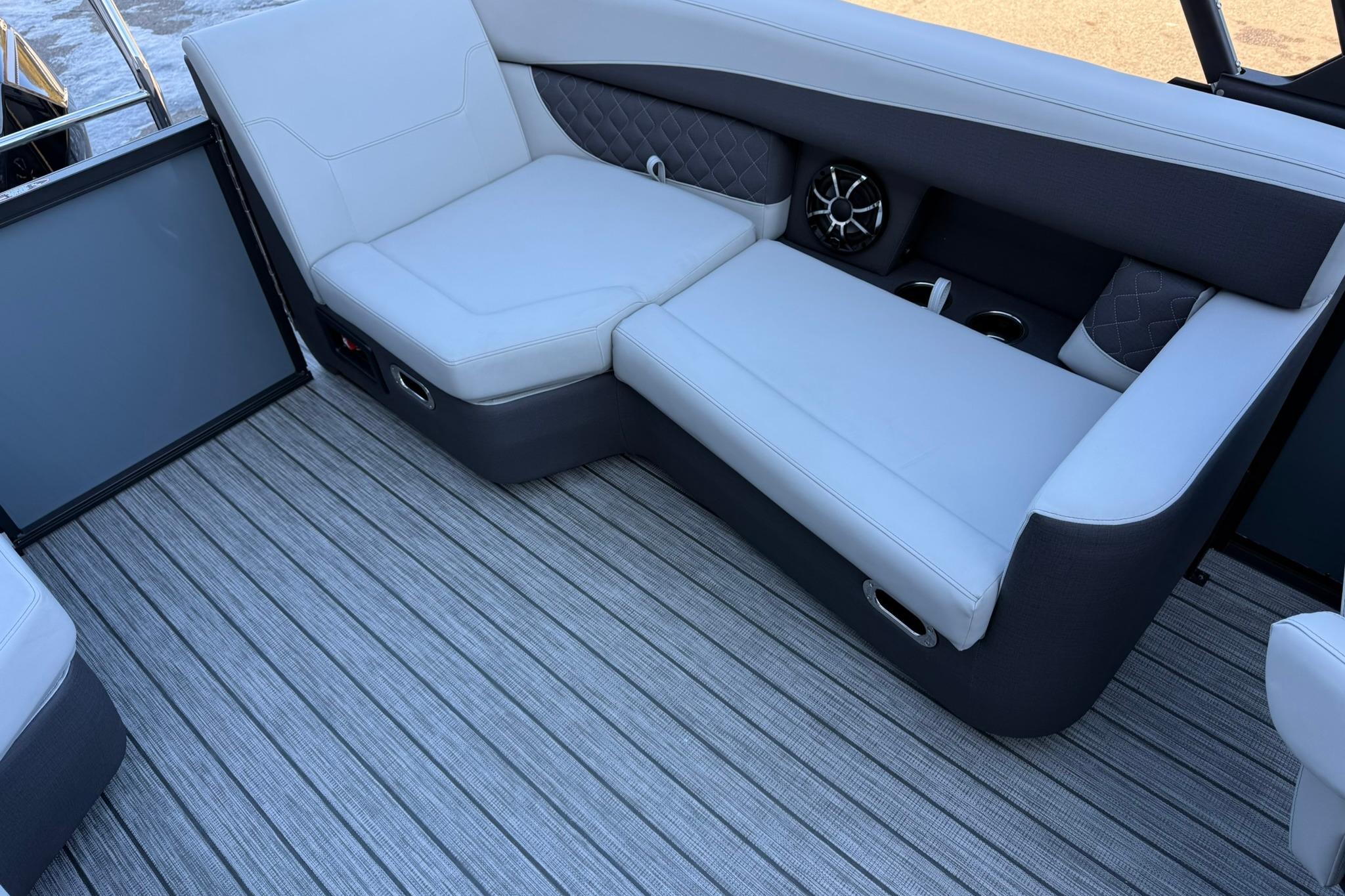 Luxurious seating on 2026 Harris Sunliner 230 boat with stylish upholstery and modern design.