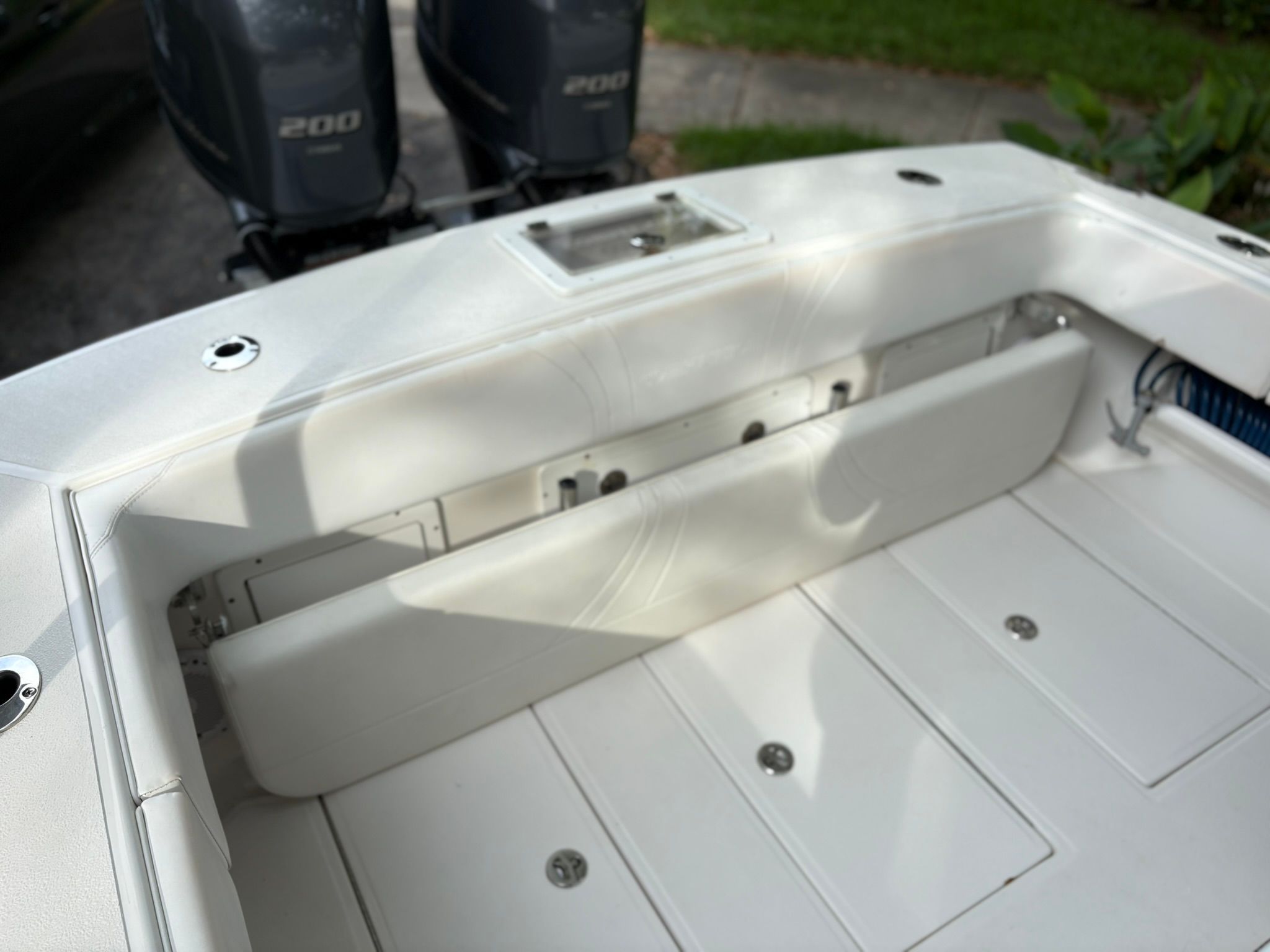 The boat has a white interior with two engines in the background.