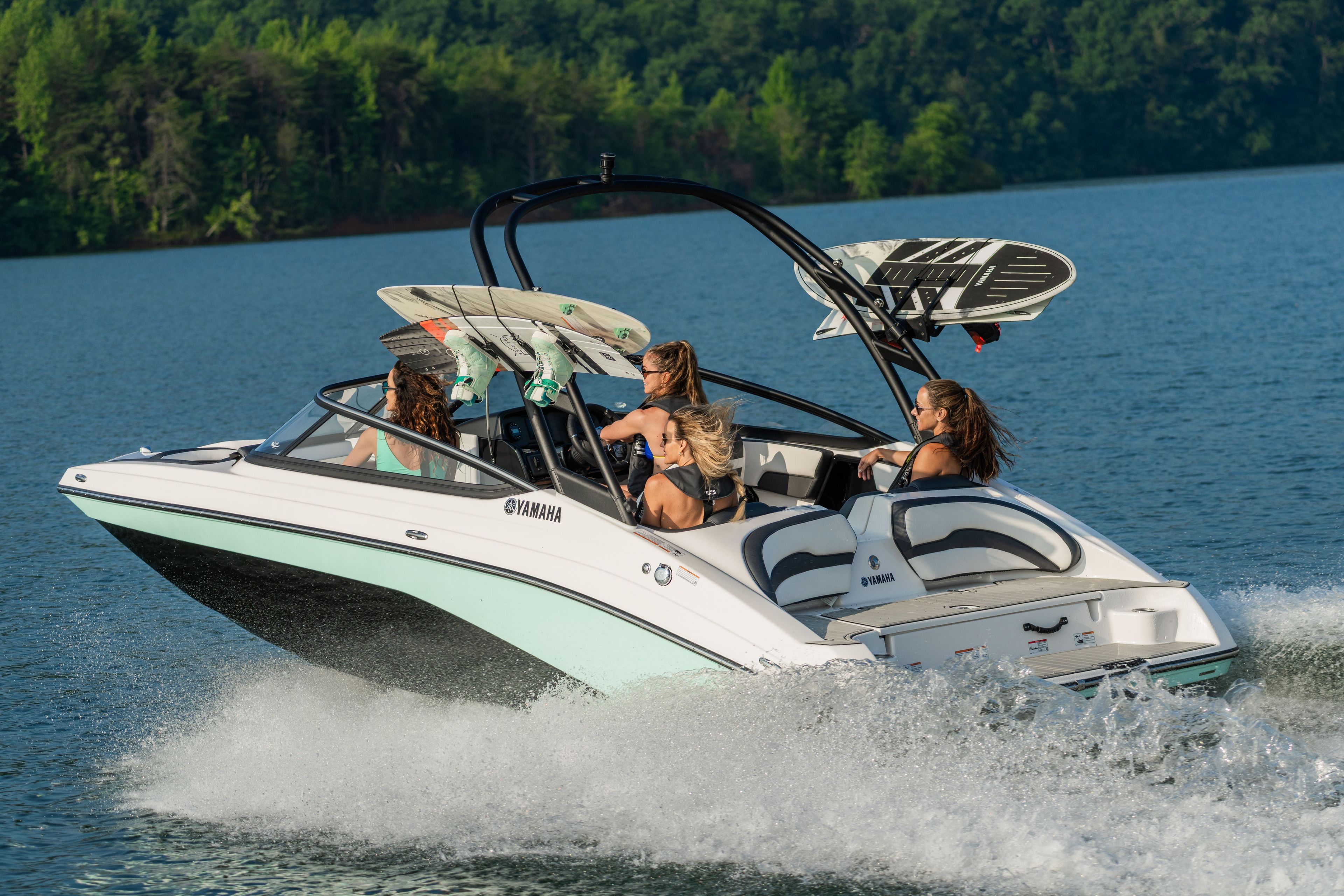Manufacturer Provided Image: 2026 Yamaha AR195 boat cruising on a lake with passengers enjoying the ride.
