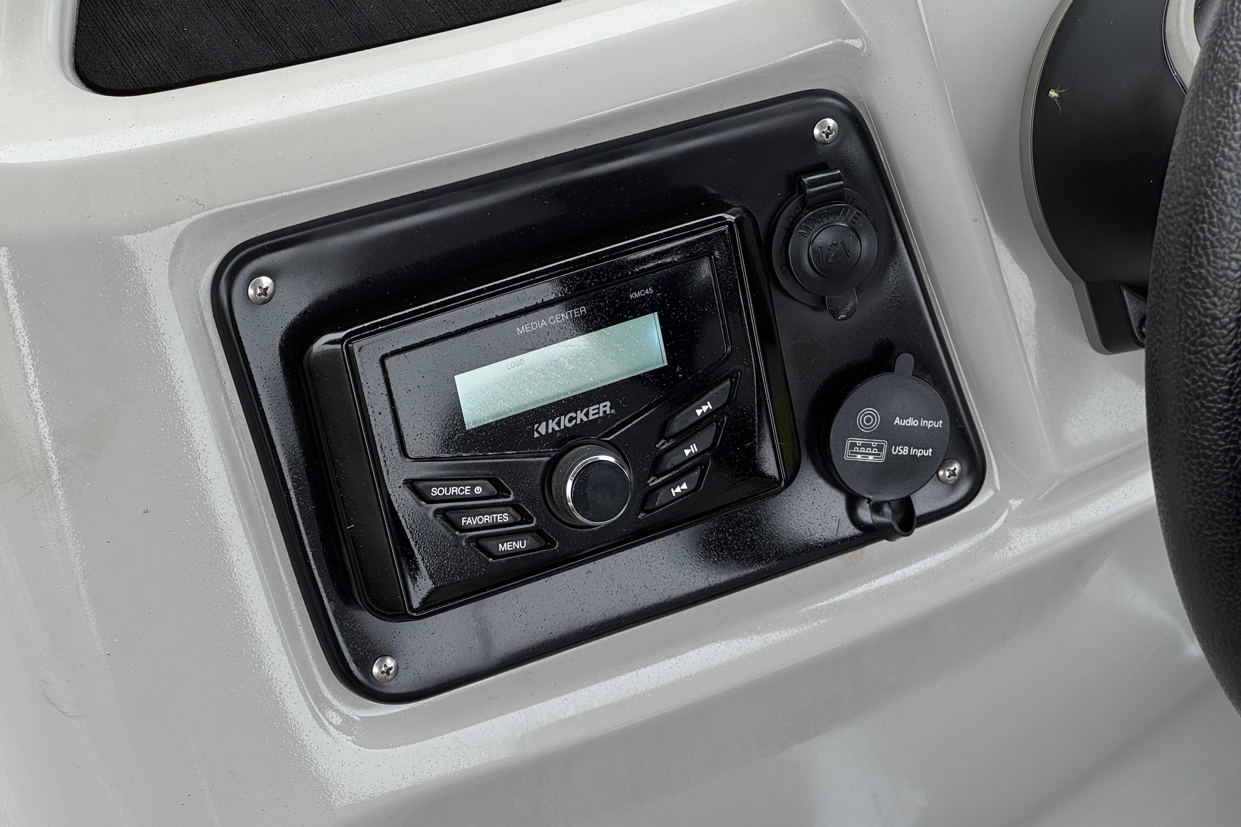 Kicker media center on 2020 Manitou 18 Aurora LE boat dashboard.