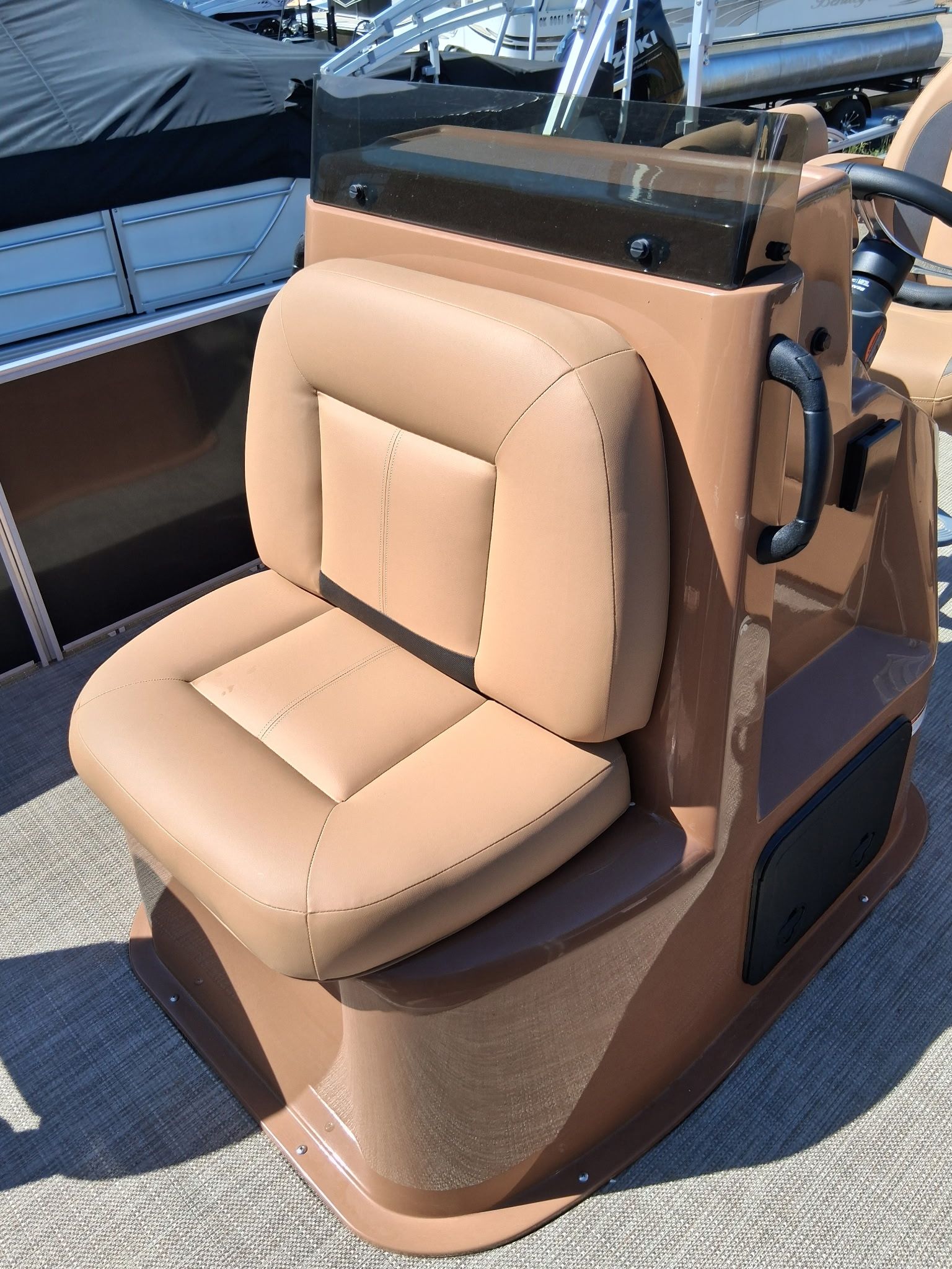 Beige seat on a 2026 Landau Alure 23CC Fish-Charcoal boat.