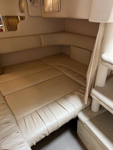 Interior of 2001 Sea Ray 340 Sundancer with beige upholstery.