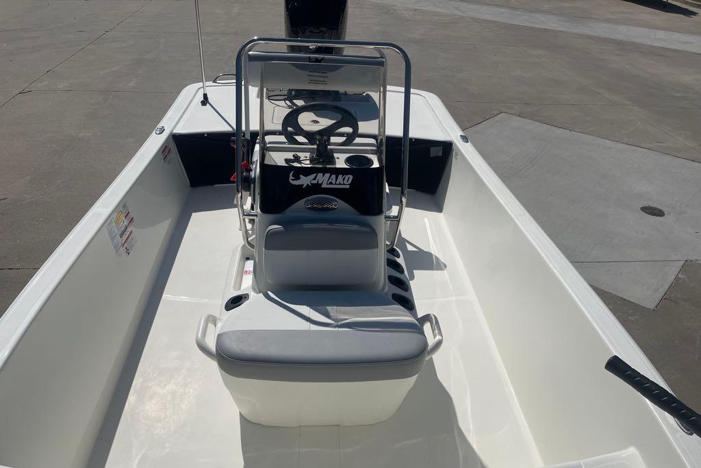 2026 Mako Pro Skiff 17 CC boat interior with steering console and seating.