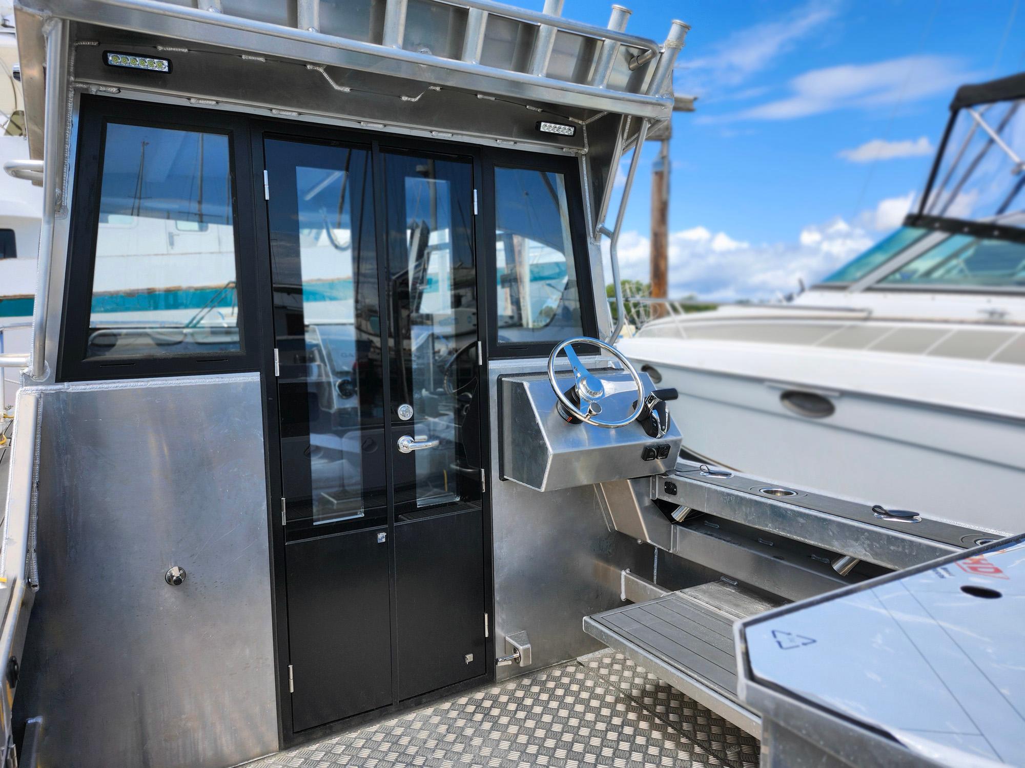 2024 Gospel Boat Profisher 750, sleek design, docked with clear blue sky background.
