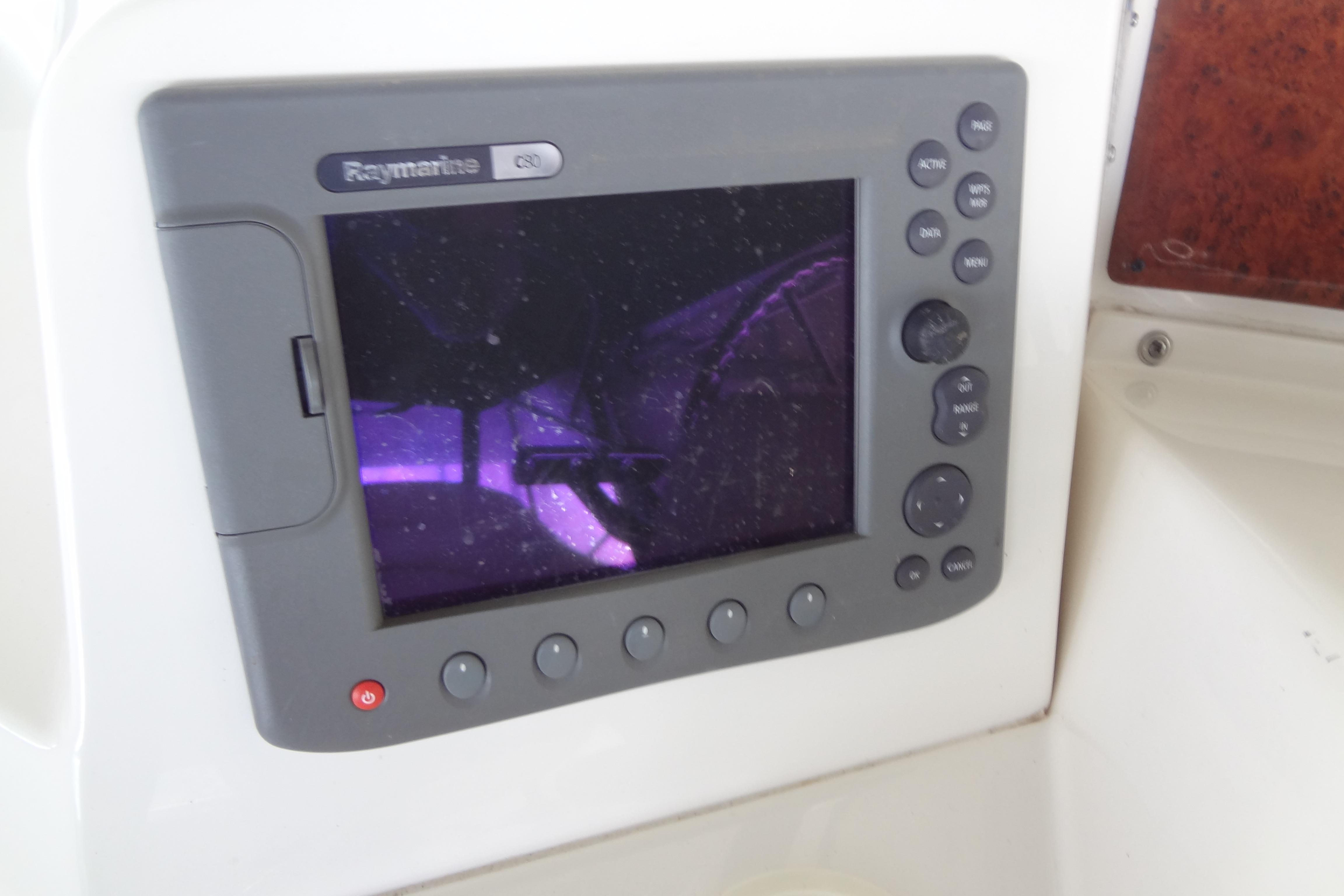 Raymarine C80 display on 2005 Silverton 34 Convertible boat dashboard.