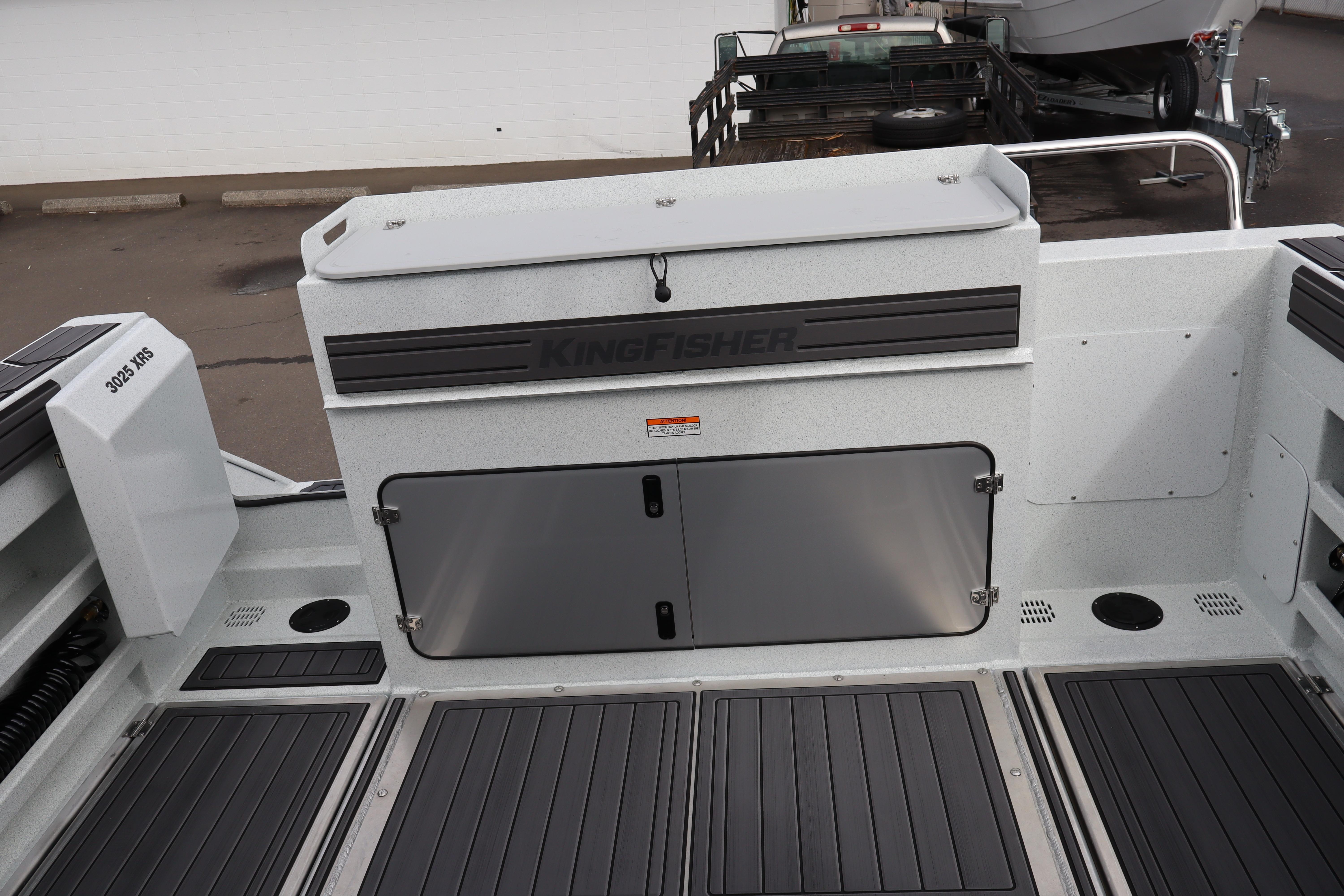 2026 KingFisher 3025 XRS boat interior with storage compartments and sleek design.
