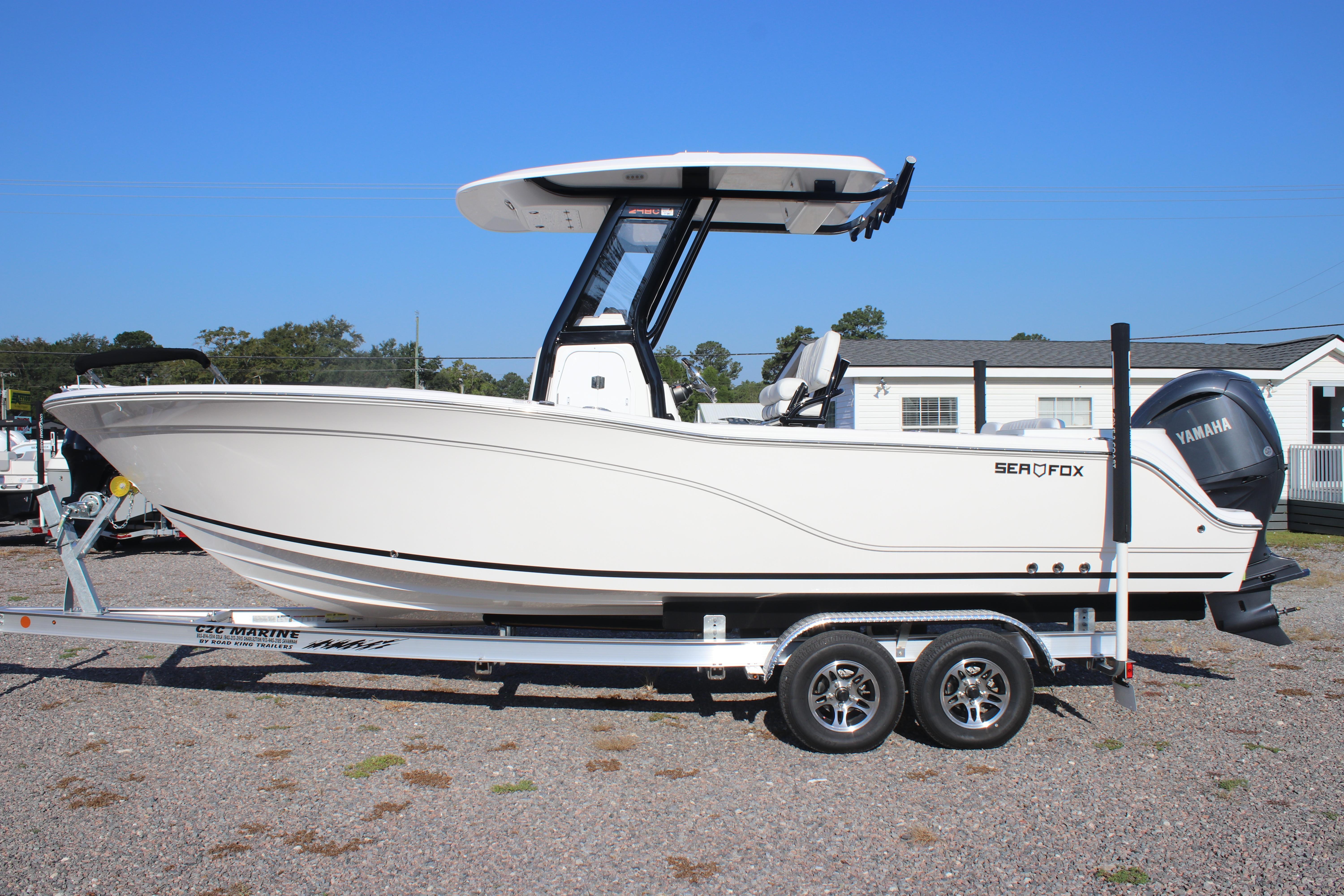 2026 Sea Fox 248 Commander boat on trailer, side view, clear sky background.