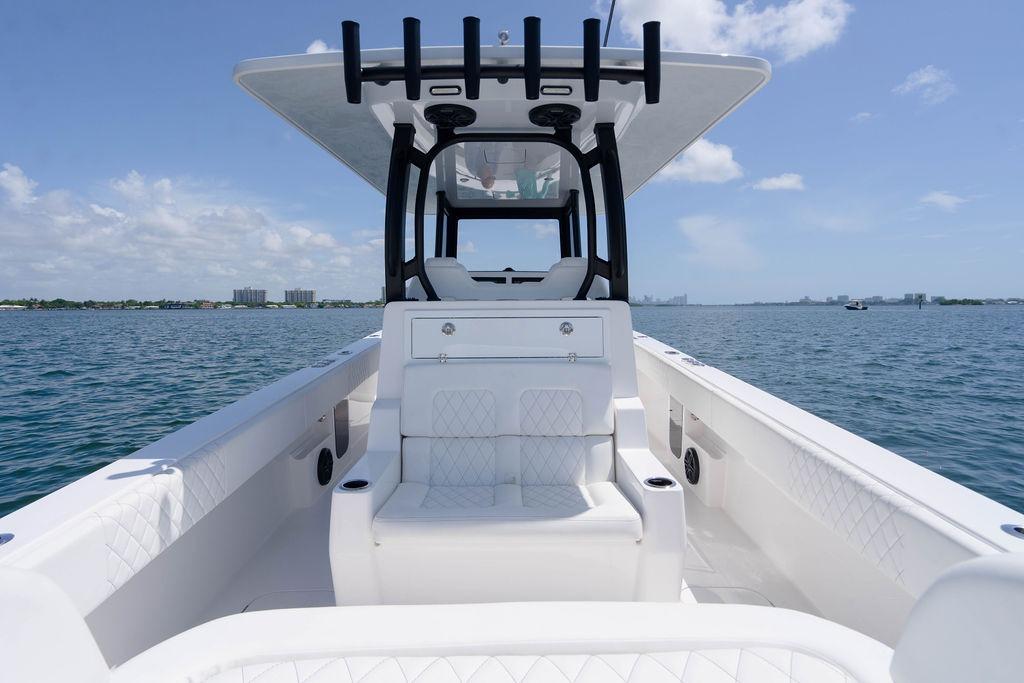 2027 Reef Runner 340 boat on open water, featuring sleek design and spacious seating.