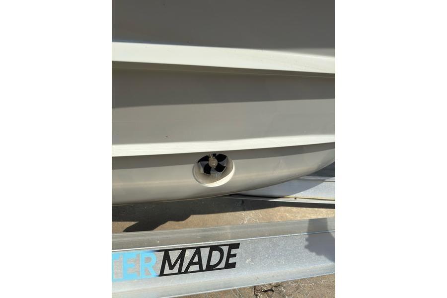 2025 Grady-White Freedom 325 boat hull detail with trailer.