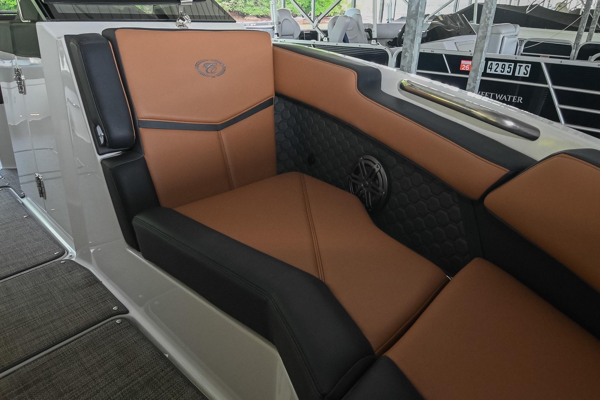 Luxurious seating in 2022 Cobalt R6 Surf boat with brown and black upholstery.
