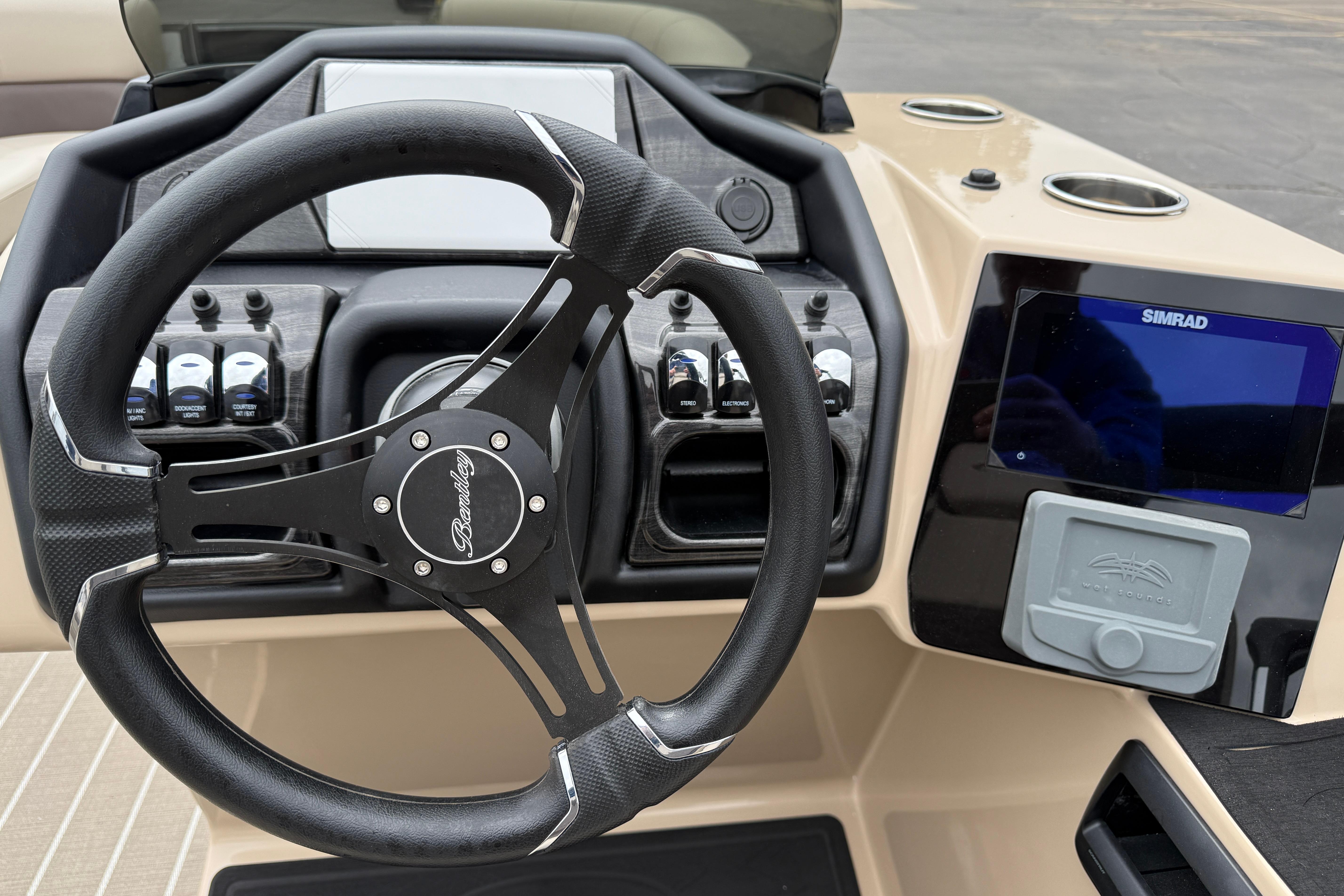 Steering console of 2026 Bentley Pontoons Elite 253 Admiral with Simrad display.