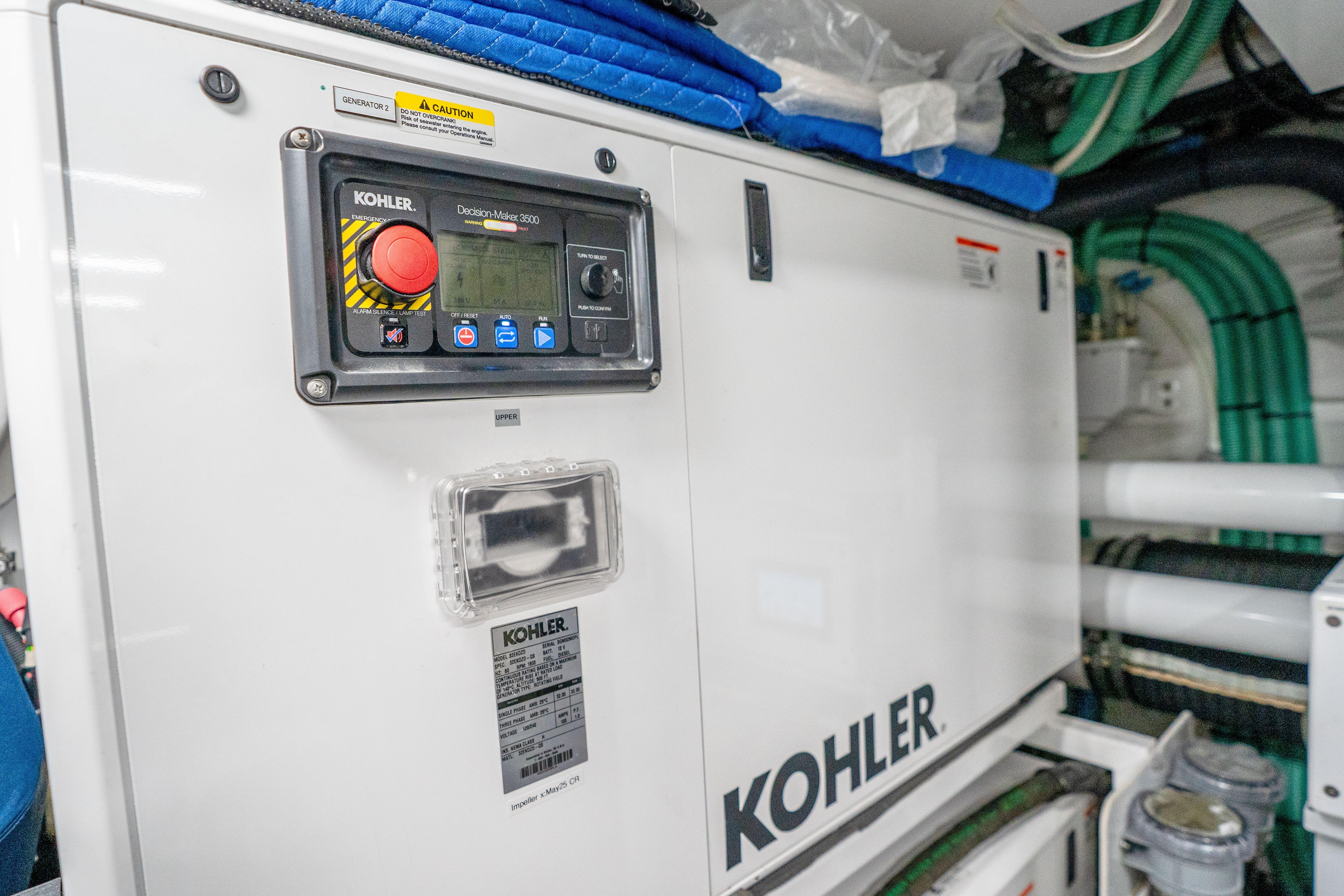 Engine room of 2020 Princess Y85 yacht featuring Kohler generator system.