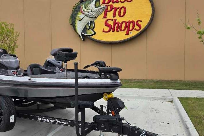 2025 Ranger Z518 boat on trailer outside Bass Pro Shops store.