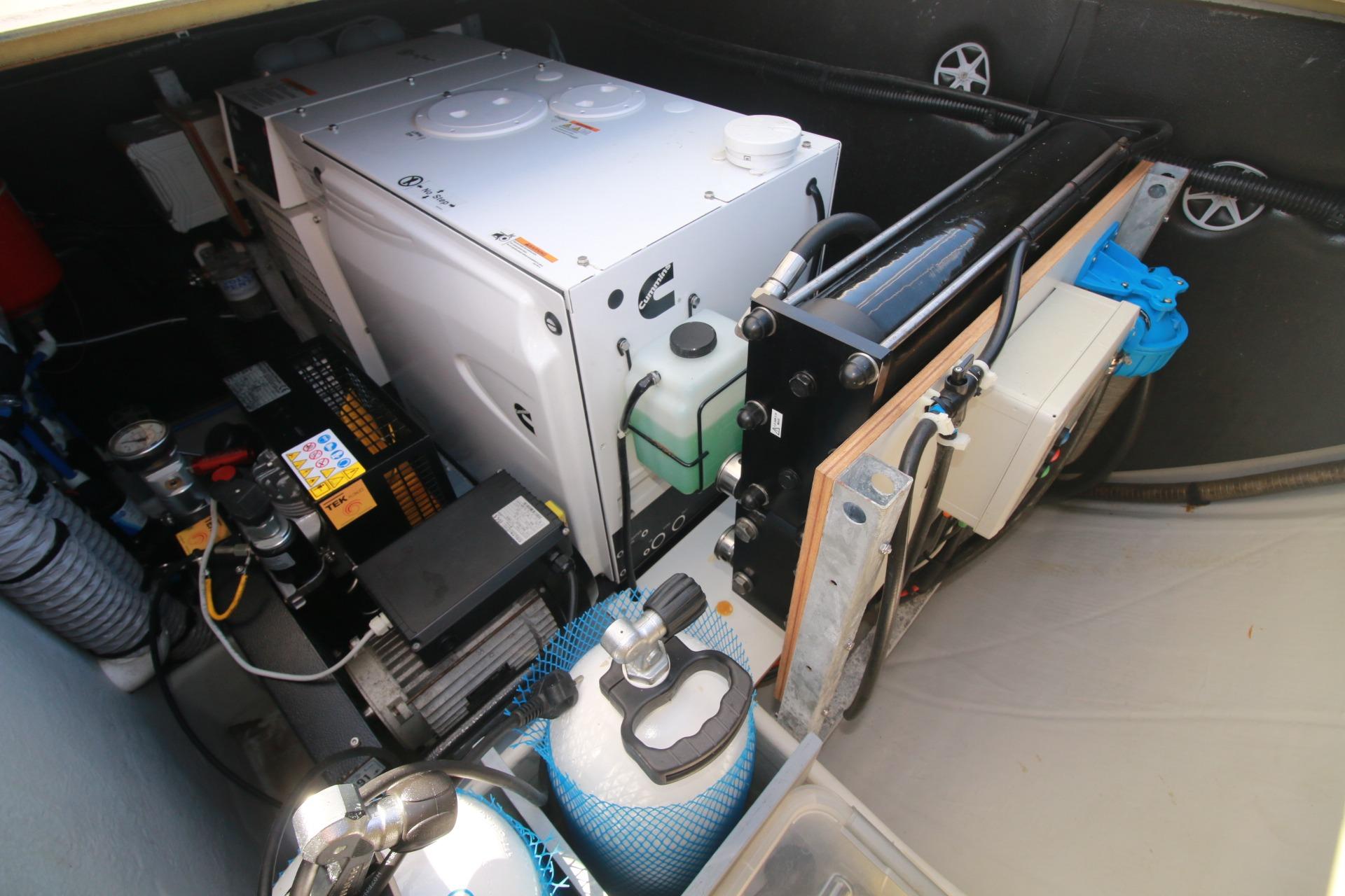 Engine room of 2022 Fountaine Pajot Elba 45 Catamaran, showcasing mechanical equipment and components.