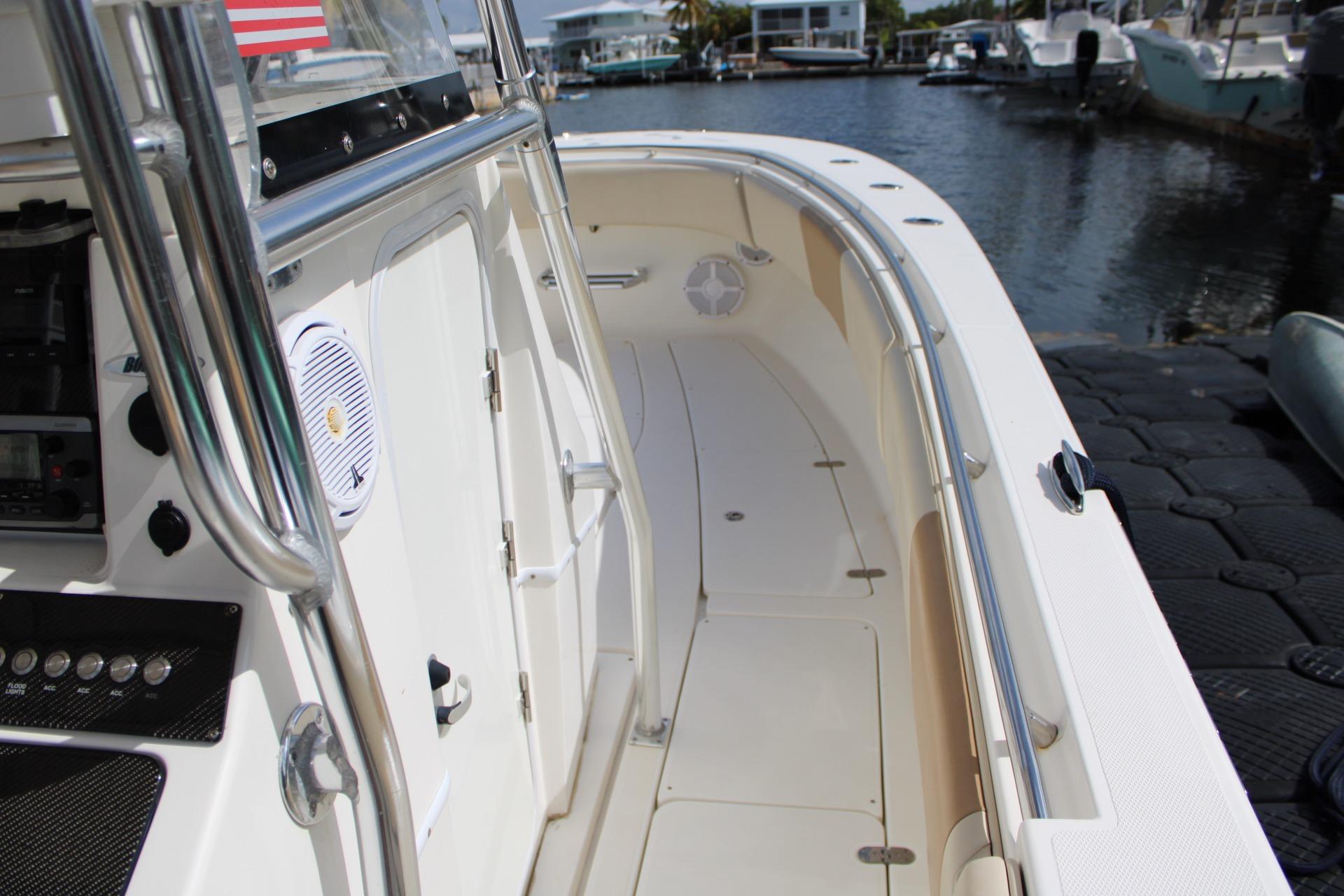 2007 Fountain 34 Center Console boat docked, showcasing sleek design and spacious deck.