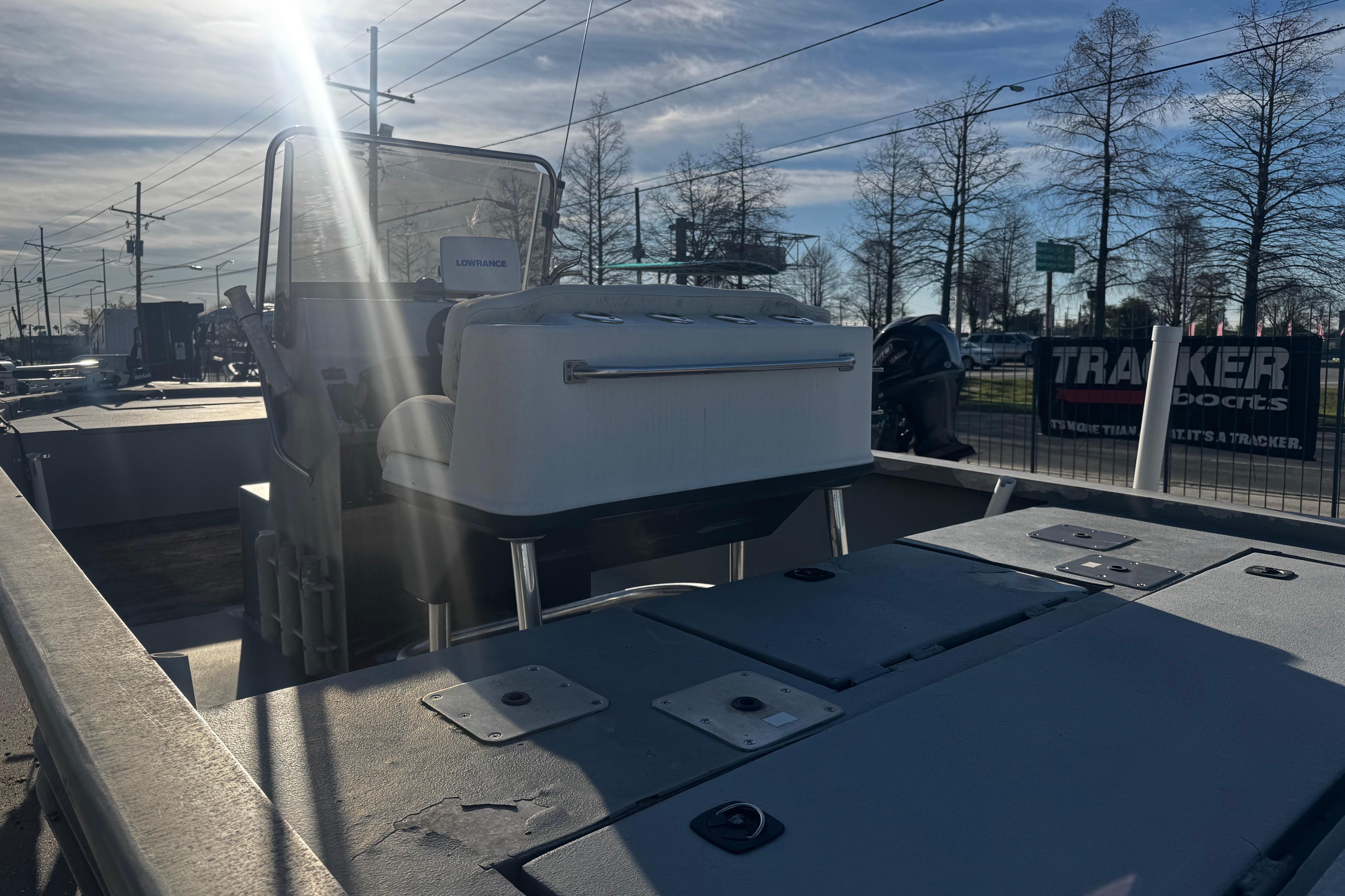 Custom Charles Leonard 21 boat, 2004 model, with sunlit deck and Lowrance equipment.