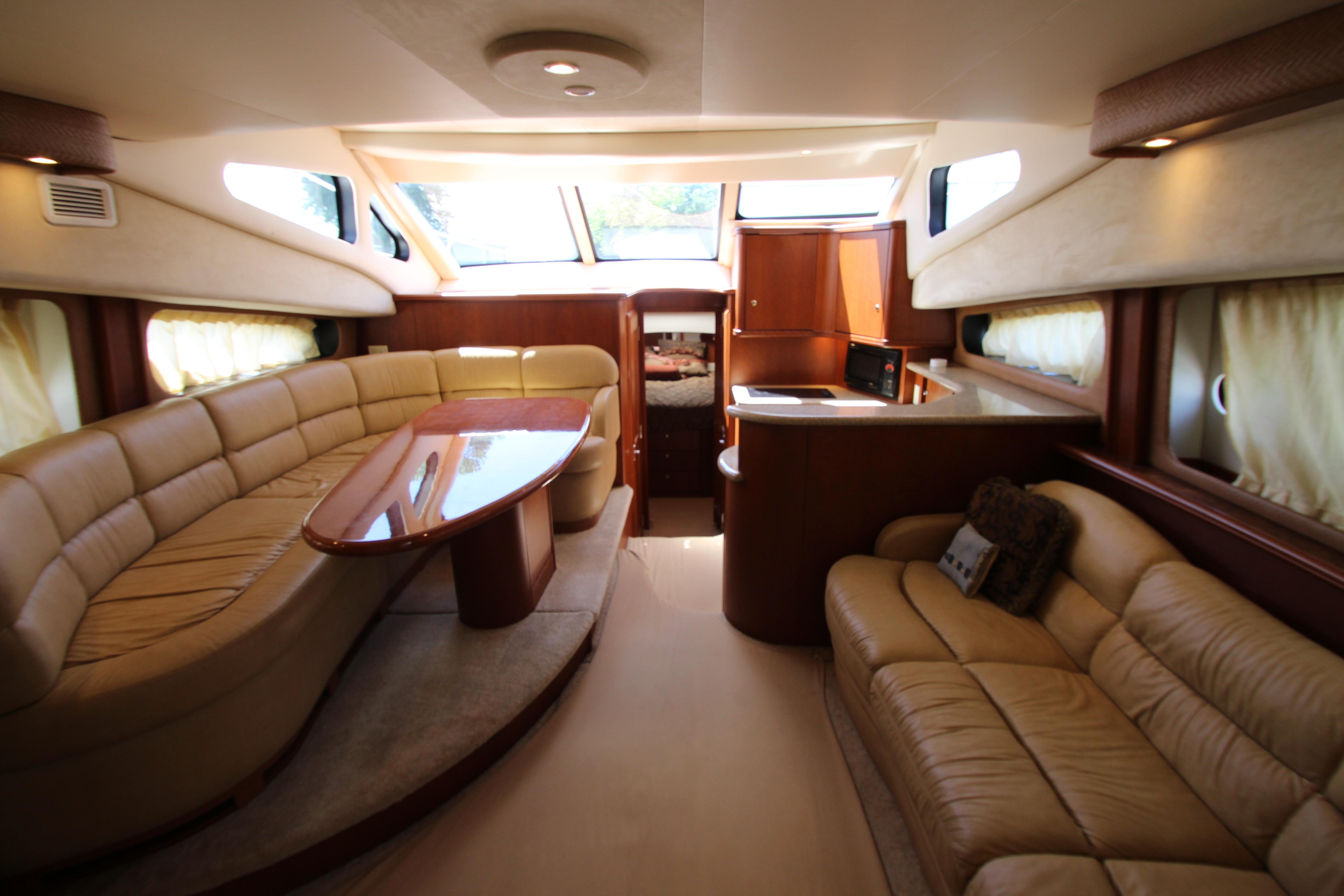 Luxurious interior of a 2006 Silverton 38 Sport Bridge yacht with plush seating and elegant design.