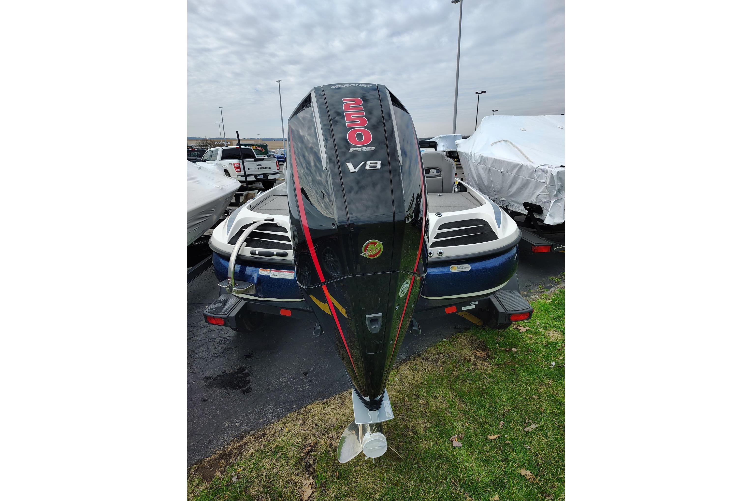 2024 Nitro Z20 boat with powerful V8 engine, parked outdoors.