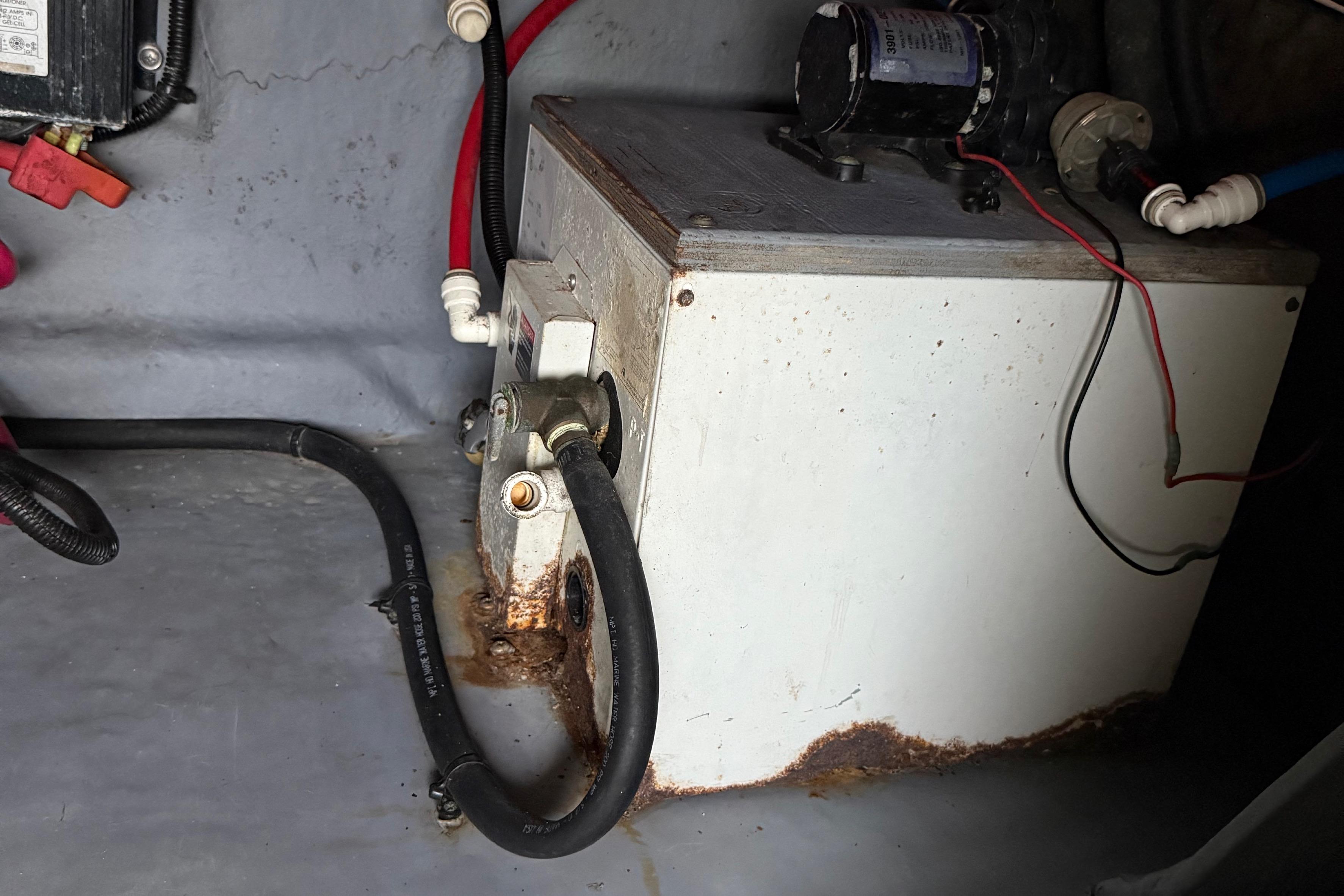 Engine compartment of a 2001 Sea Ray 260 Sundancer with visible wiring and components.