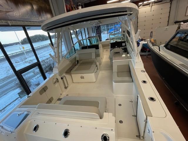 2023 Boston Whaler 280 Vantage boat interior with seating and storage compartments.