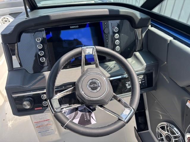 2026 Chaparral SSX 6 boat dashboard with steering wheel and digital display.