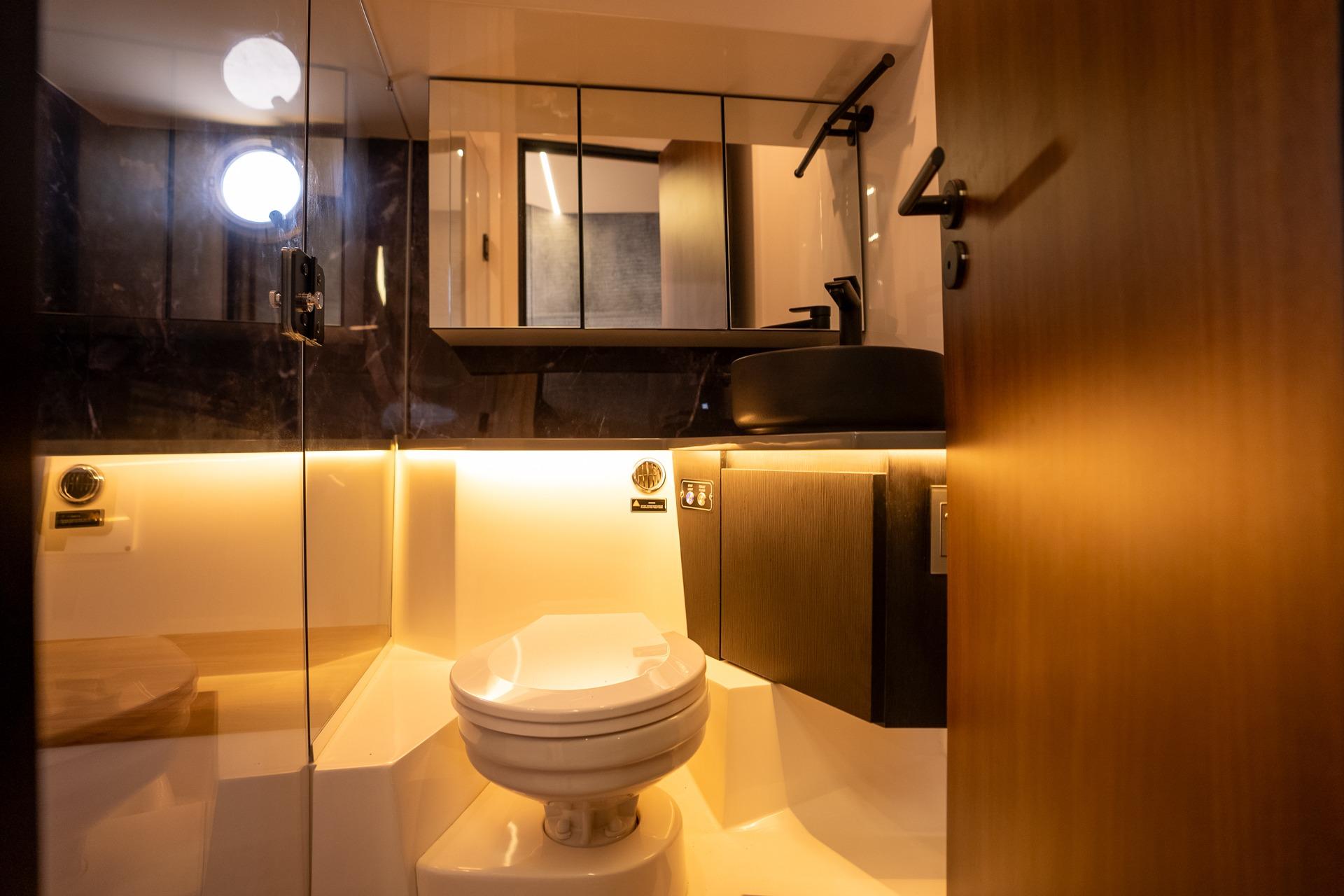 Luxurious bathroom interior in 2026 Hanover 447 model, featuring modern fixtures and ambient lighting.