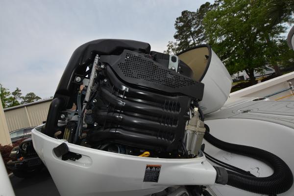2021 Sea Pro 228 Bay boat engine, detailed view of motor components.