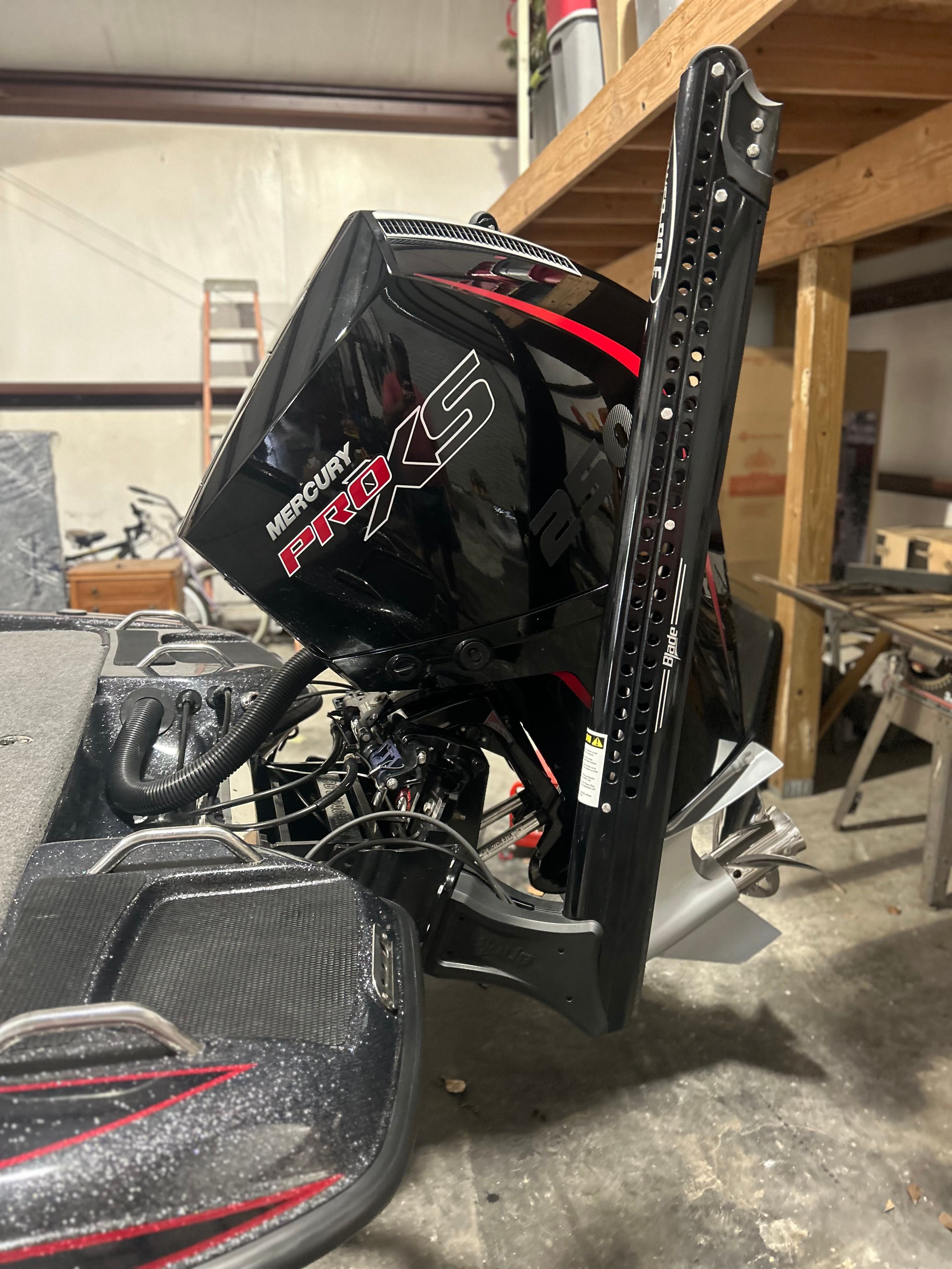 A Mercury Pro XS outboard motor is mounted on a boat.