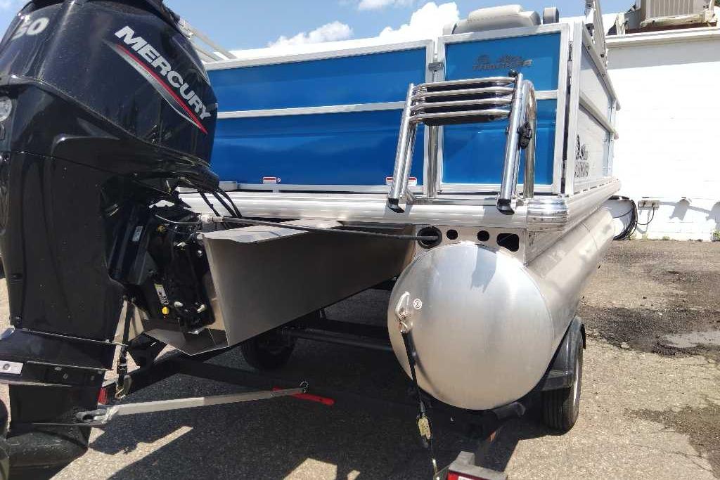 2026 Sun Tracker Party Barge 16 DLX with Mercury outboard motor, rear view.
