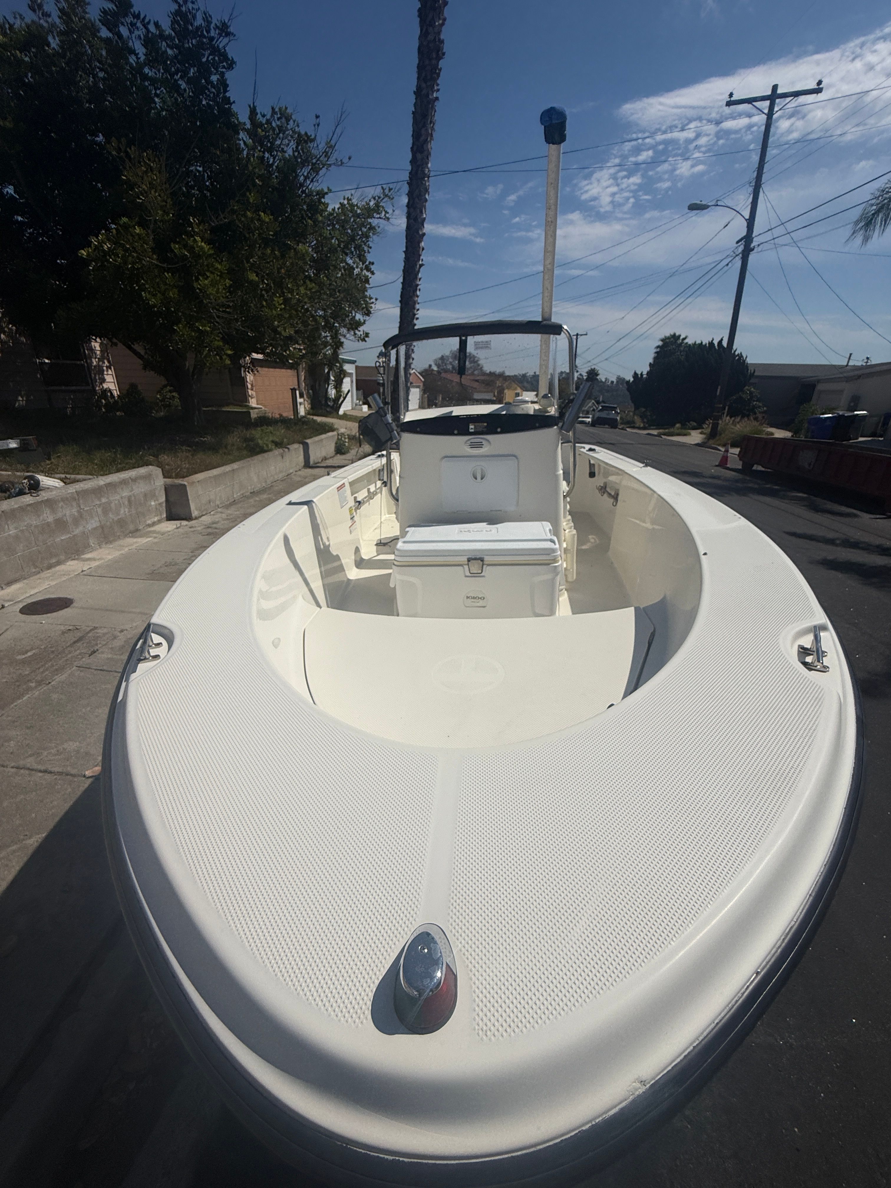 2008 Trophy 1703 Center Console boat parked on street.
