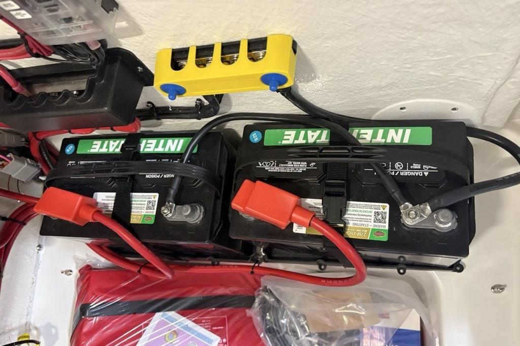 Battery setup in a 2026 Tidewater 2210 Carolina Bay boat, featuring Interstate batteries.