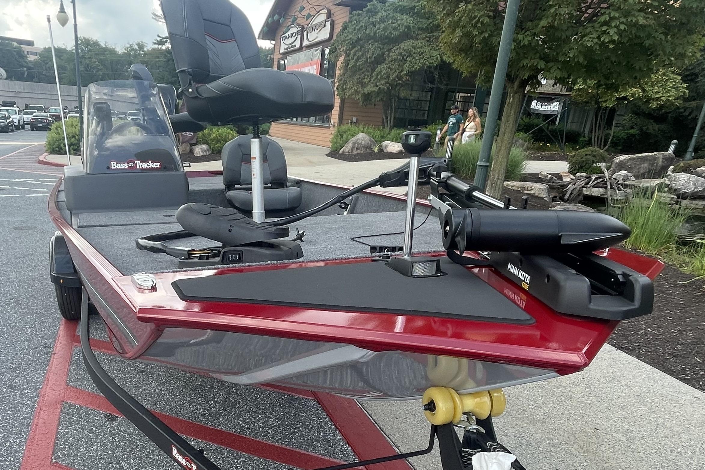 2026 Tracker Bass Tracker Classic XL boat with seating and trolling motor in a parking lot.