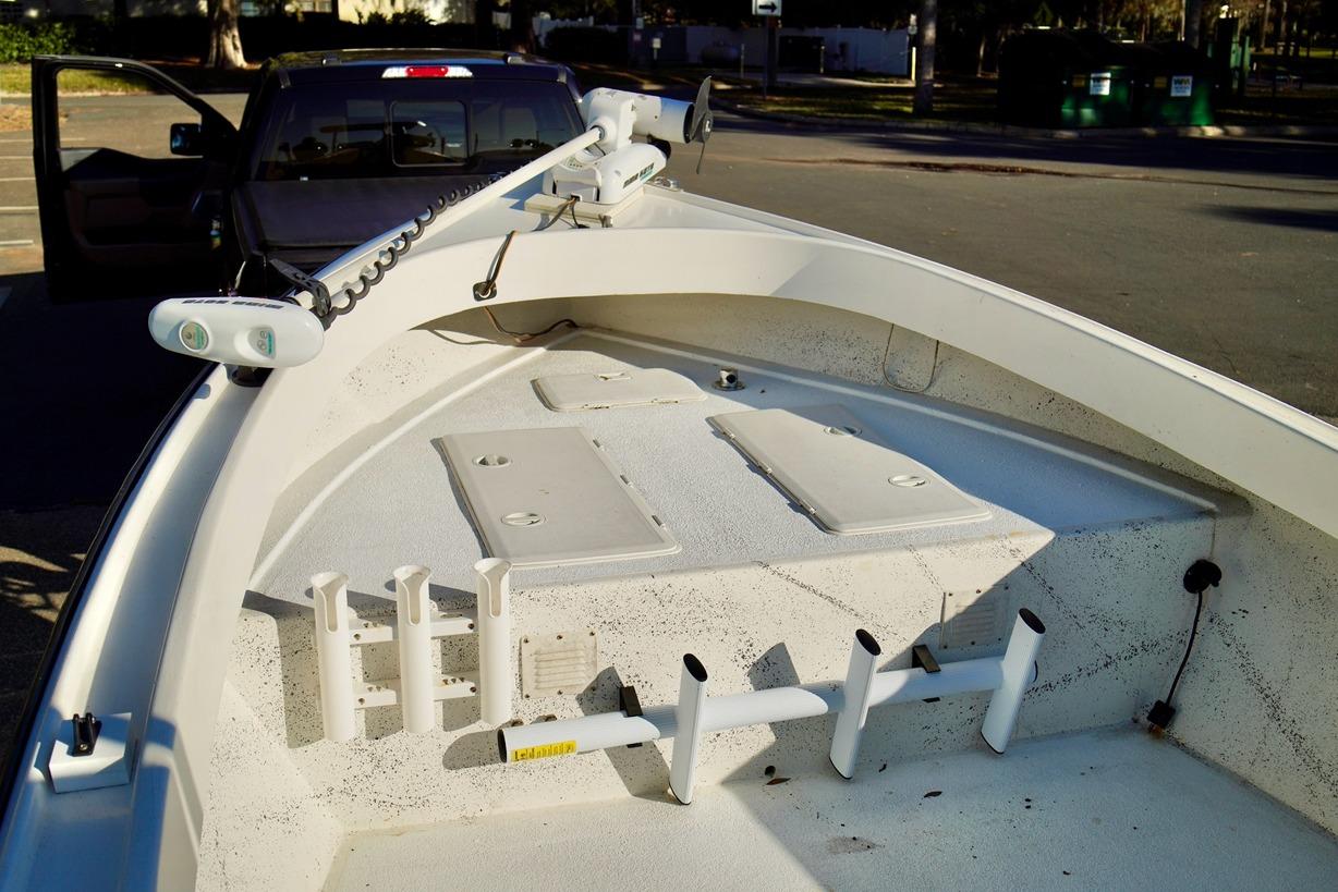 1970 Aquasport 222 Flatback boat interior with rod holders and storage compartments.