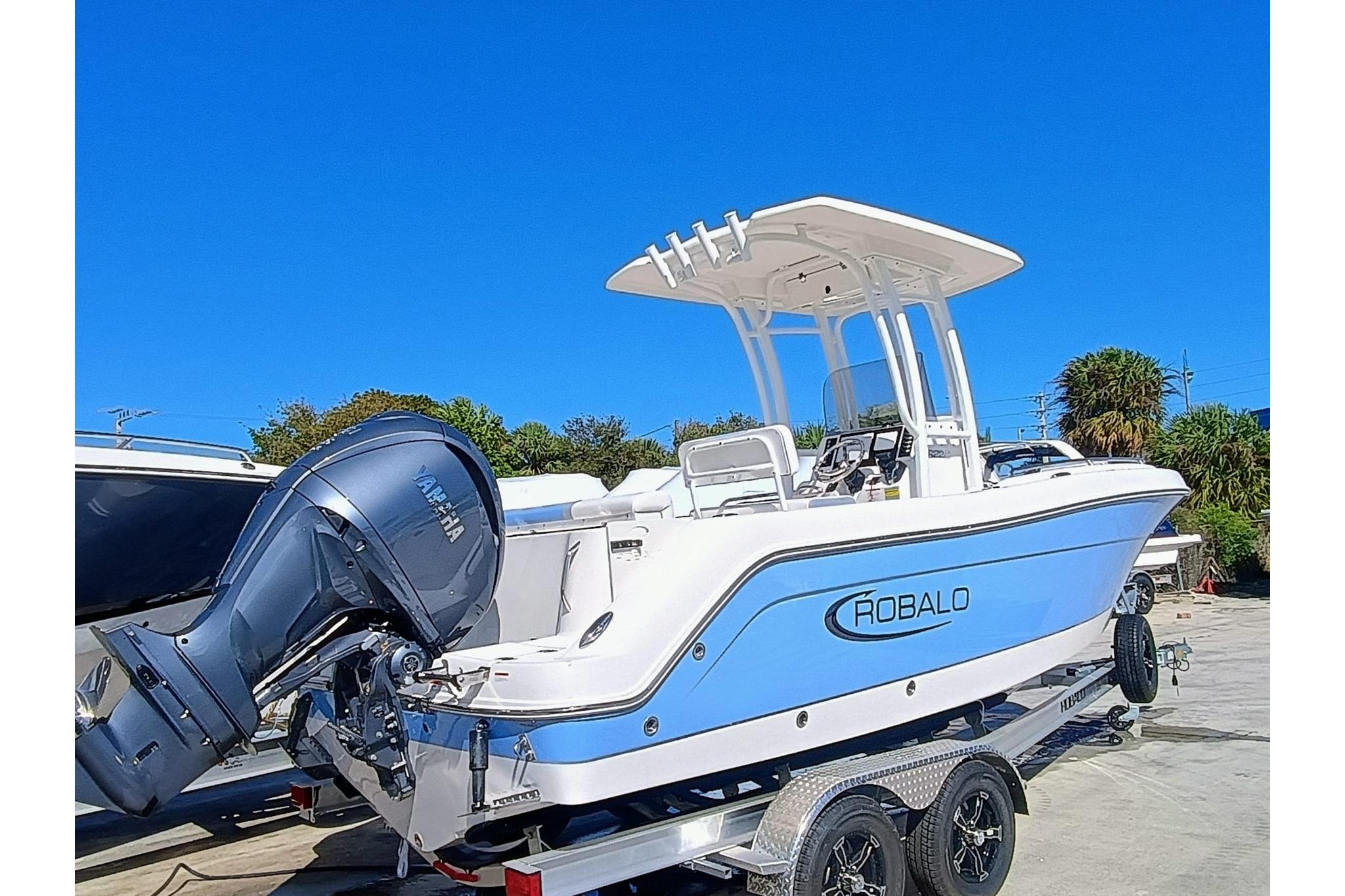 2025 Robalo R222 Center Console boat on trailer, featuring Yamaha outboard motor.