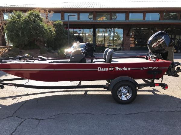 2025 Tracker Bass Tracker Classic XL boat on trailer, parked outdoors.