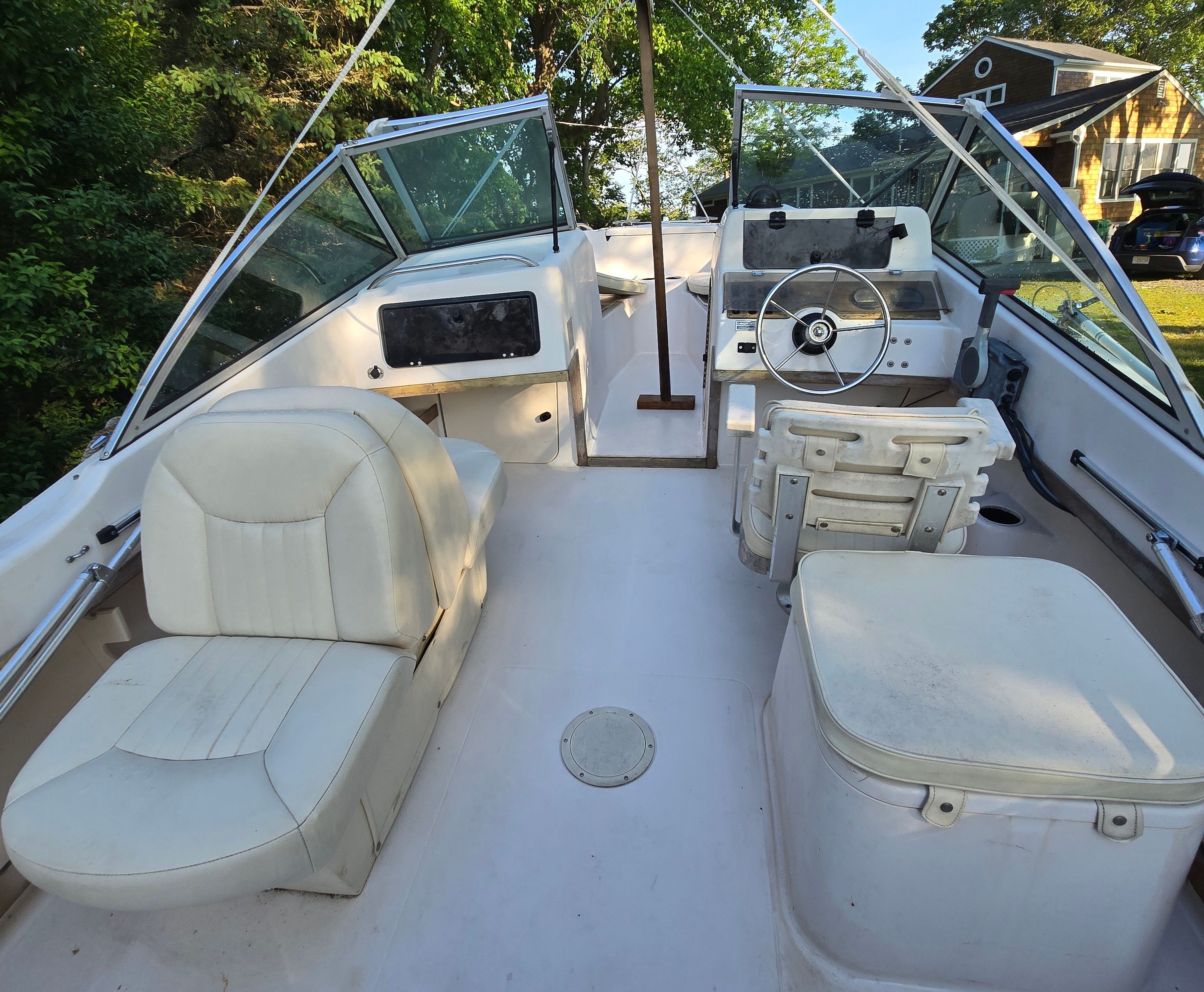 The image shows the cockpit of a 1994 Grady-White Tournament 192 boat with white seating.