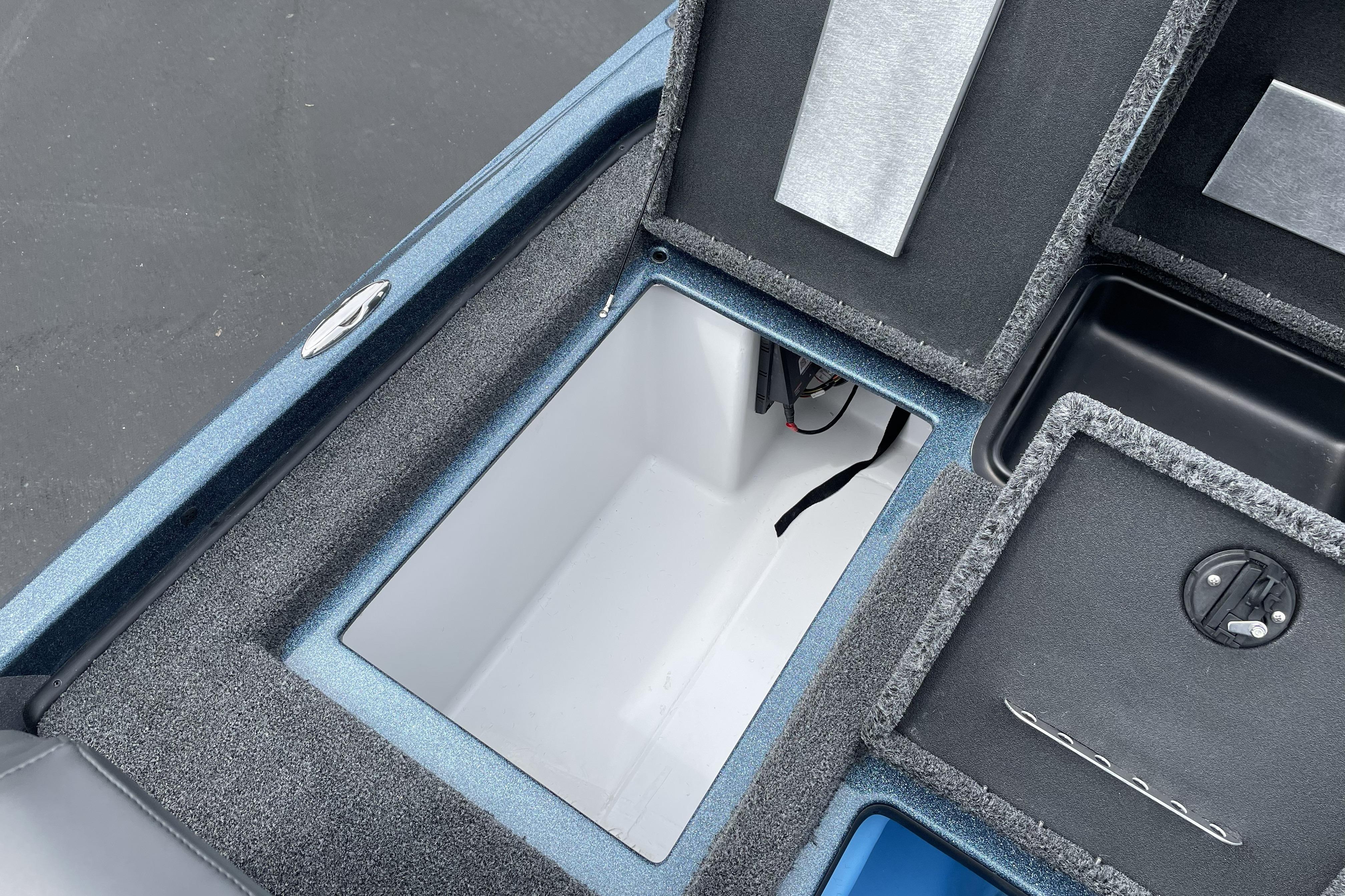 2026 Nitro Z21 XL boat storage compartments with carpeted interiors and sleek design.