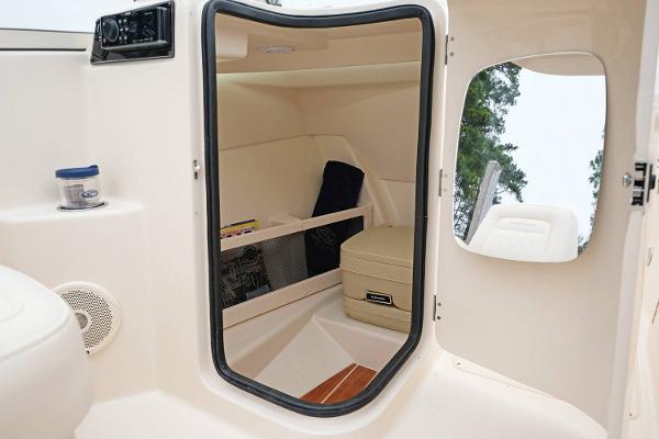 Manufacturer Provided Image: 2019 Grady-White Freedom 215 cabin interior with storage compartments and seating.