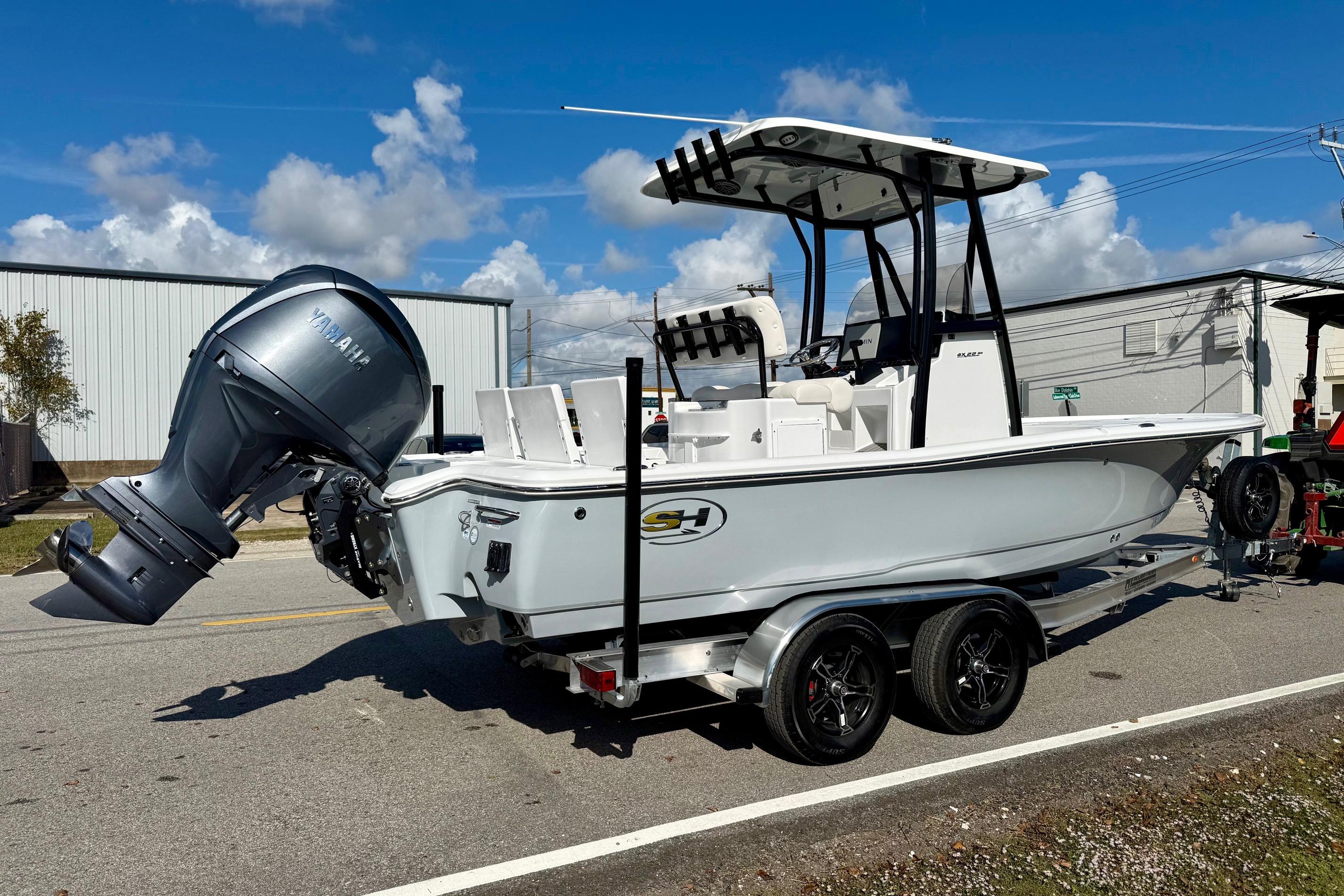 2026 Sea Hunt BX 22 BR boat on trailer, featuring Yamaha outboard motor.