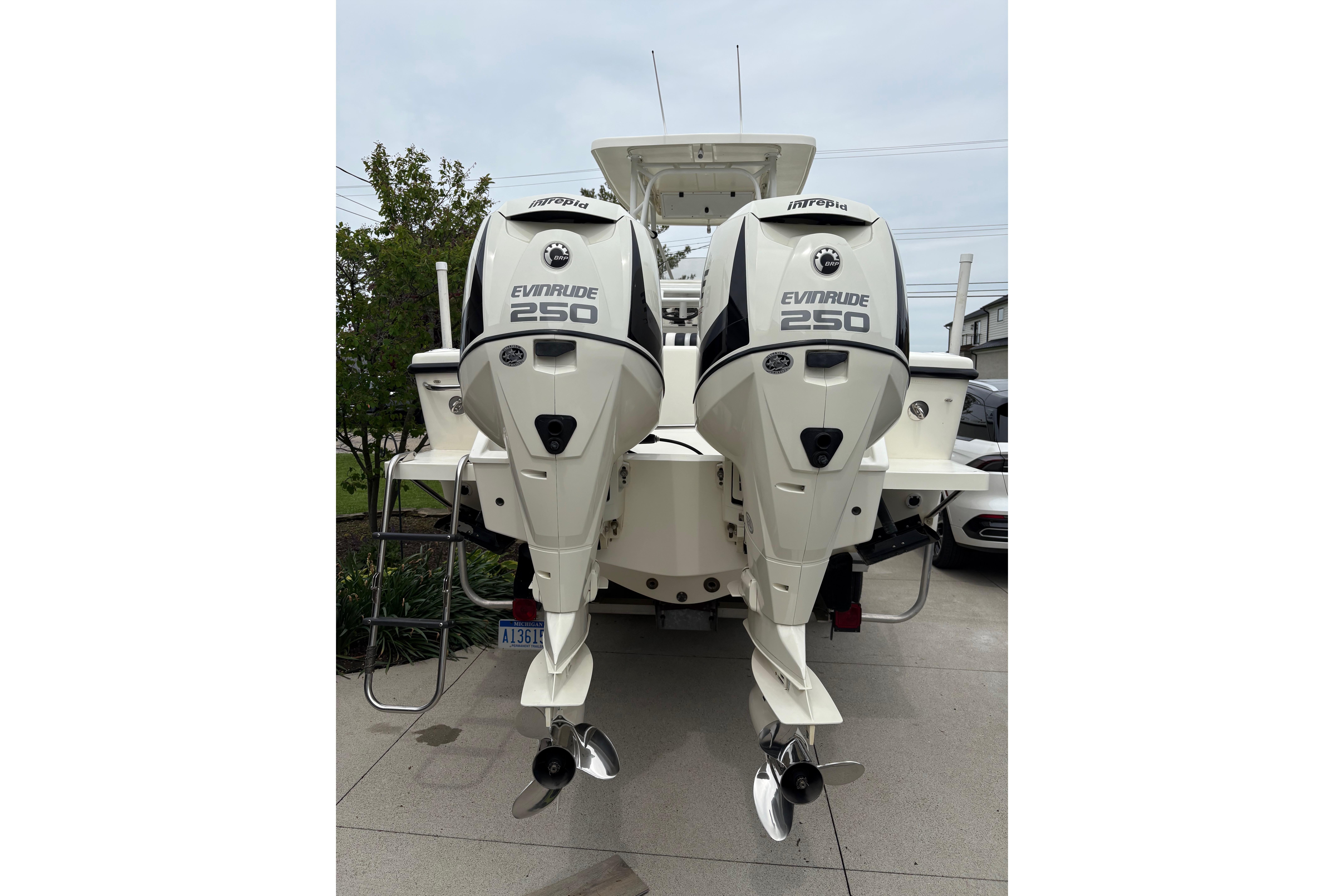 1994 Intrepid 30 Open Cuddy with dual Evinrude 250 outboard engines, rear view.
