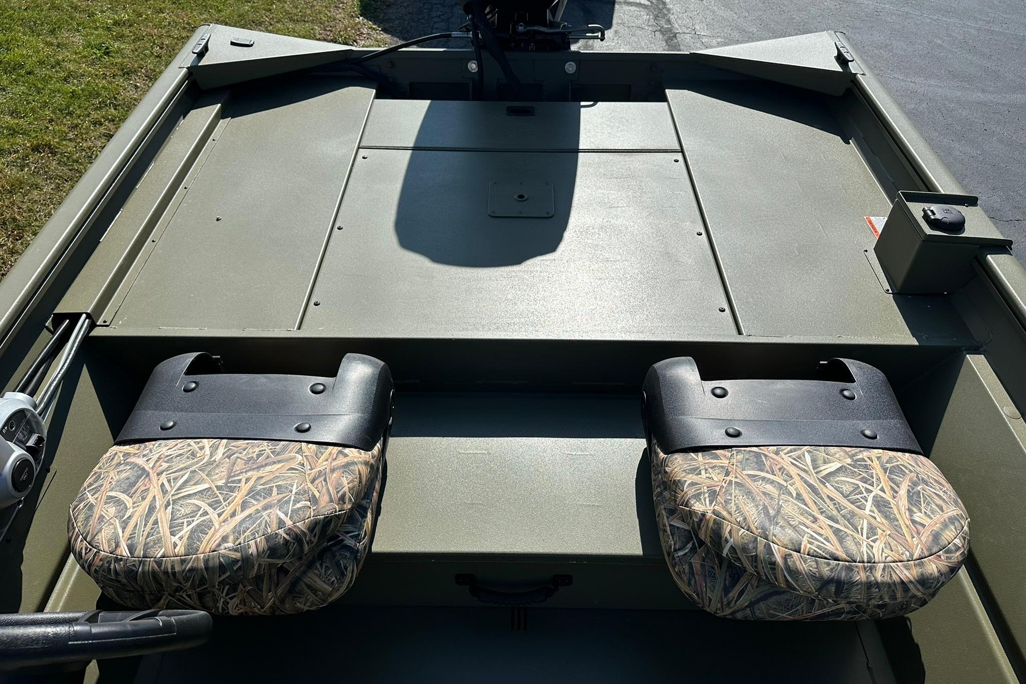 2026 Lowe Roughneck 1860SC boat interior with camo seats and spacious deck.