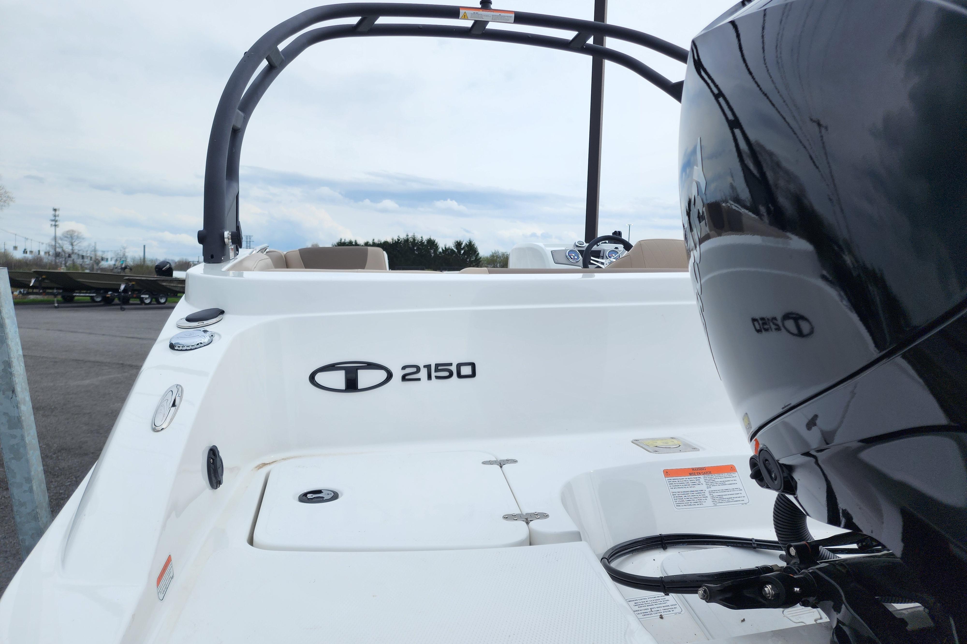 2026 Tahoe 2150 boat with sleek design and powerful engine, parked outdoors.