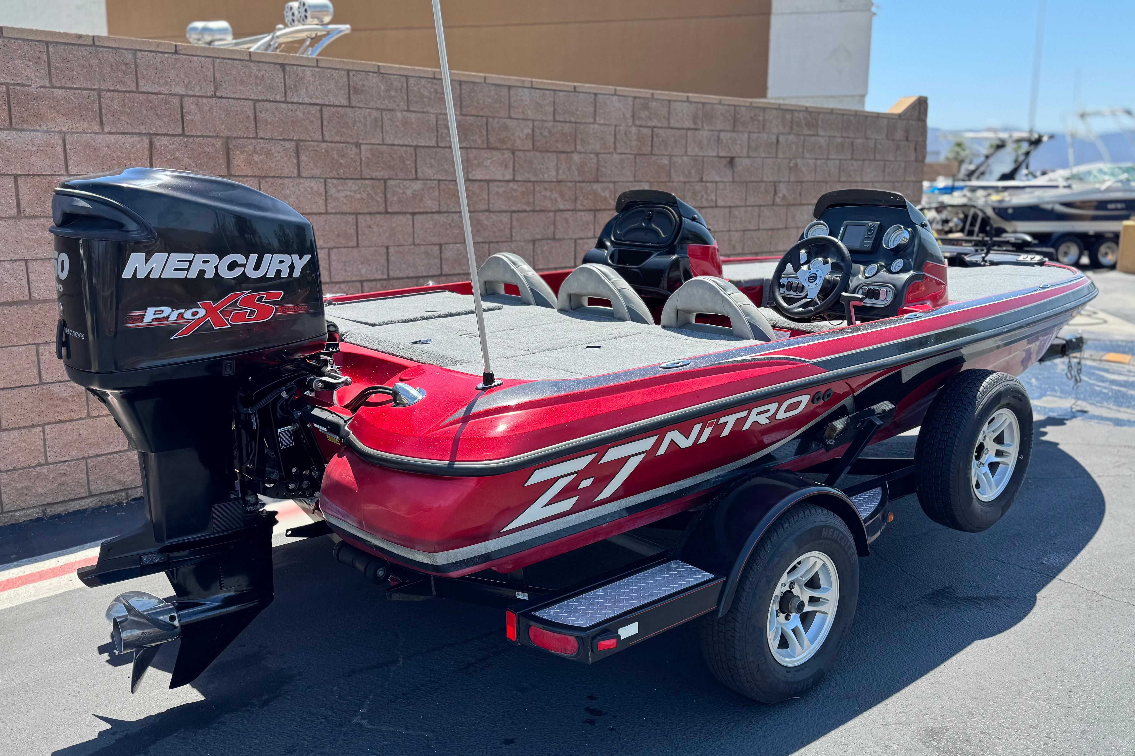 2012 Nitro Z-7 boat with Mercury Pro XS engine, parked on a trailer.