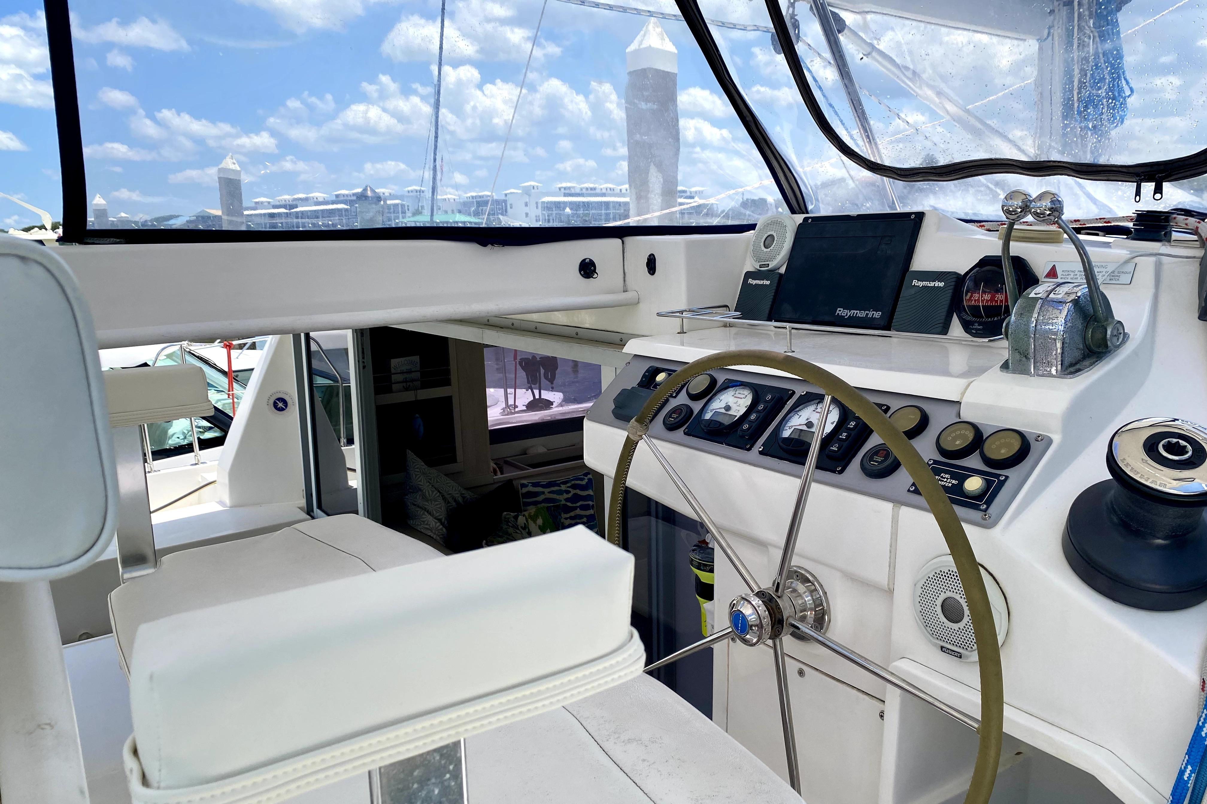 Helm of 2017 Leopard 40 catamaran with navigation equipment and steering wheel.