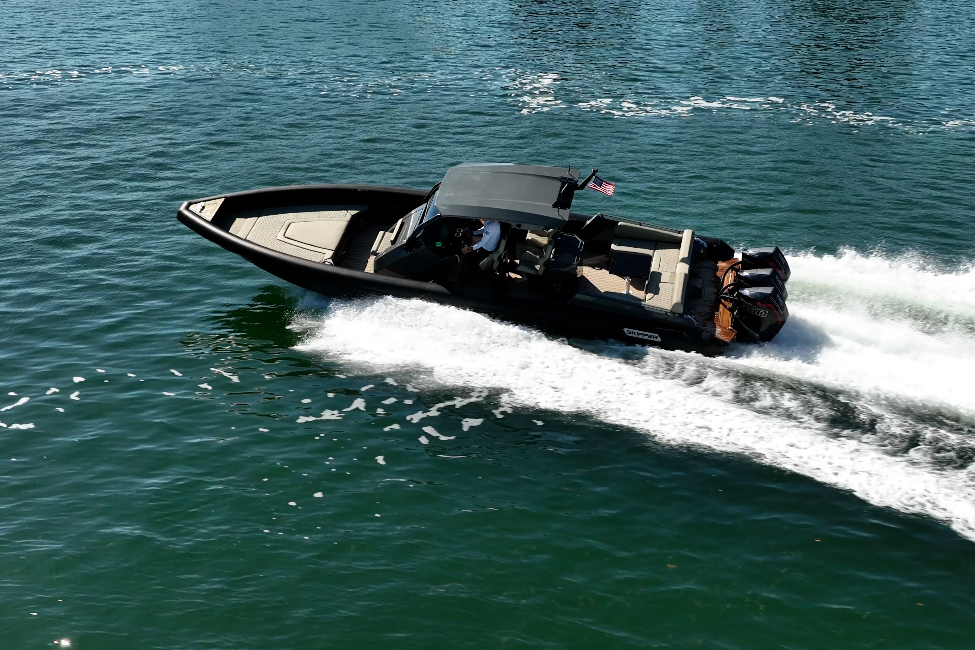 2023 Skipper-BSK 38NC boat cruising swiftly on open water.