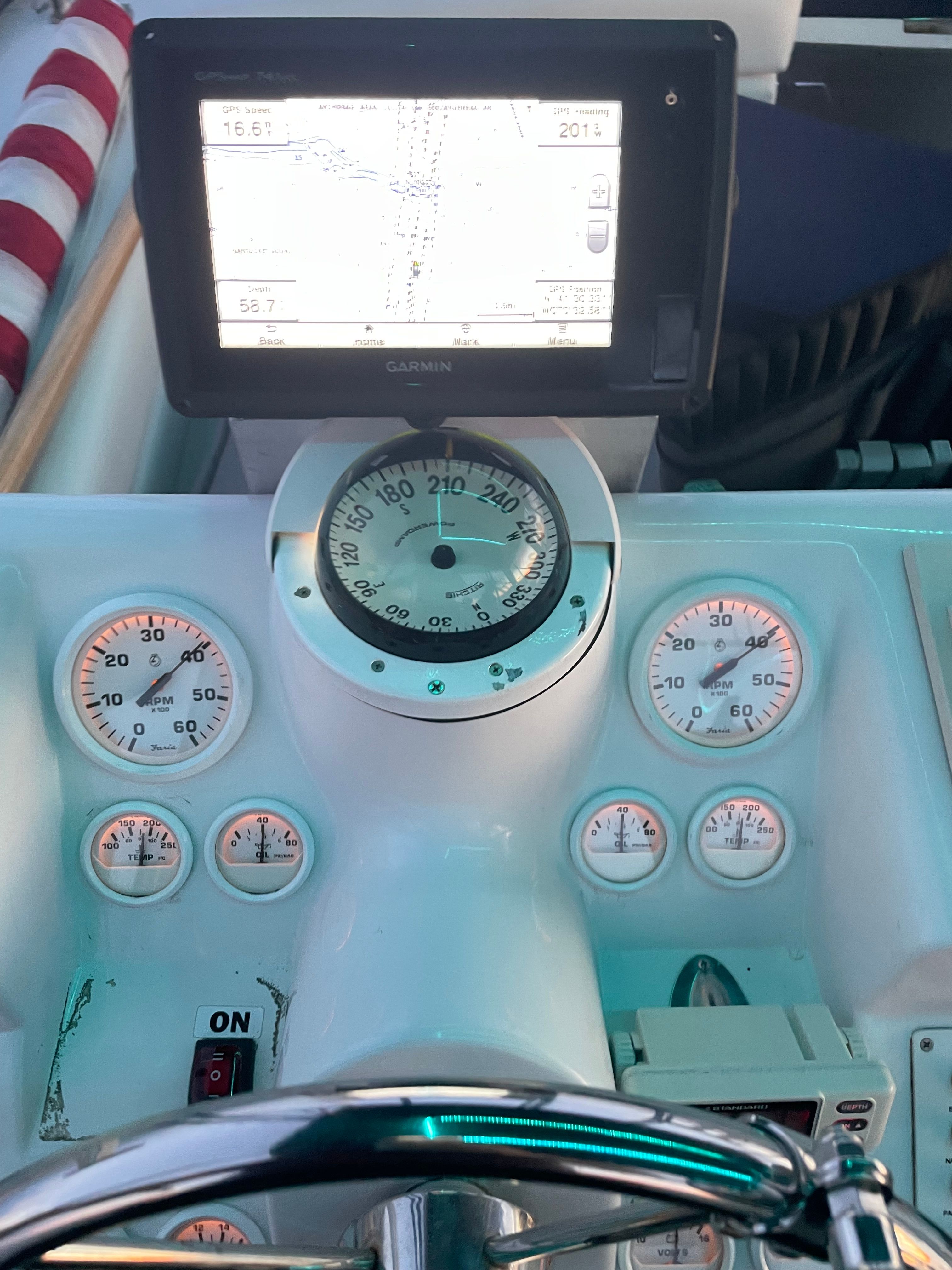Dashboard of a Mainship 31 Sedan Bridge with Garmin navigation system.