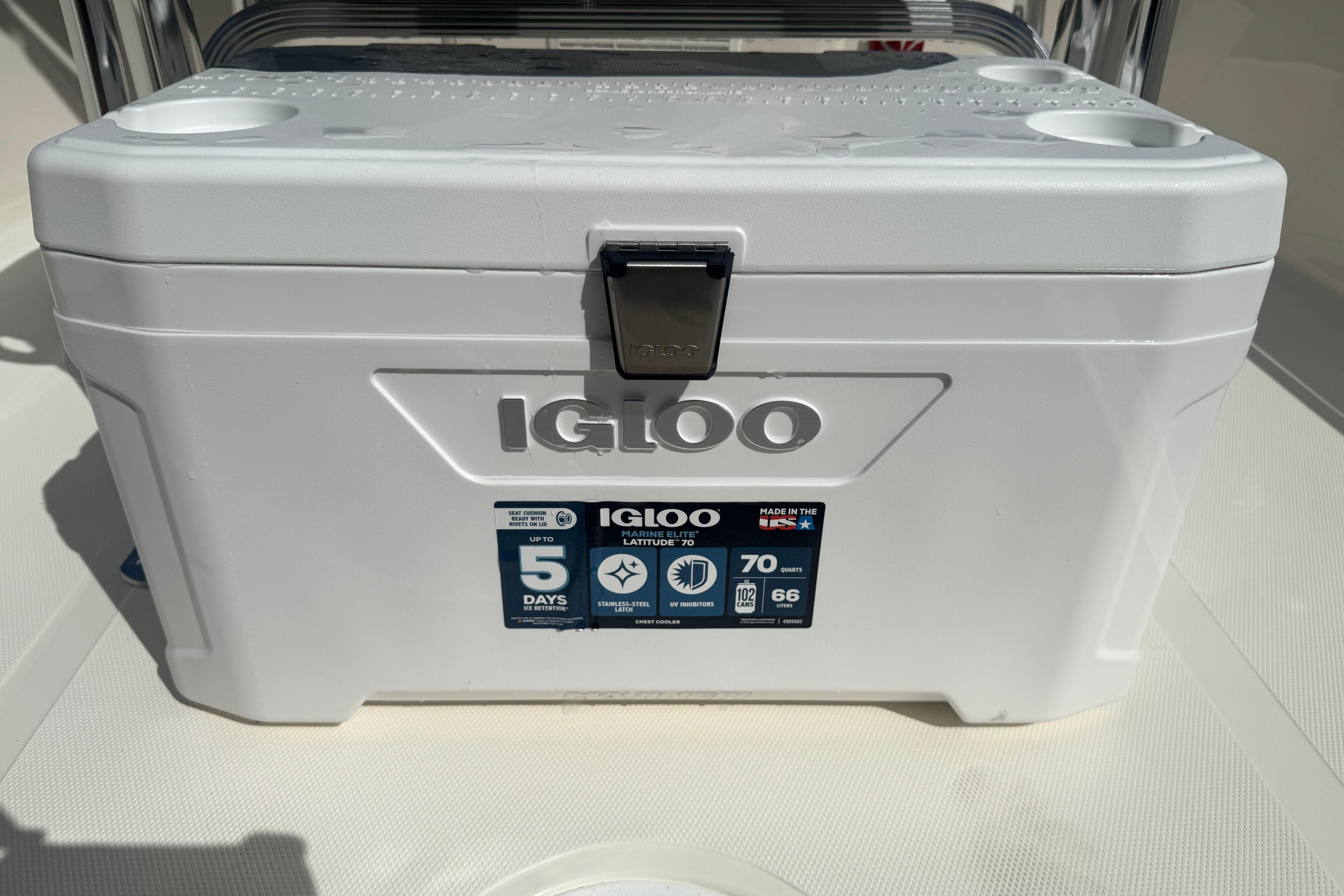 A white Igloo cooler on a boat.